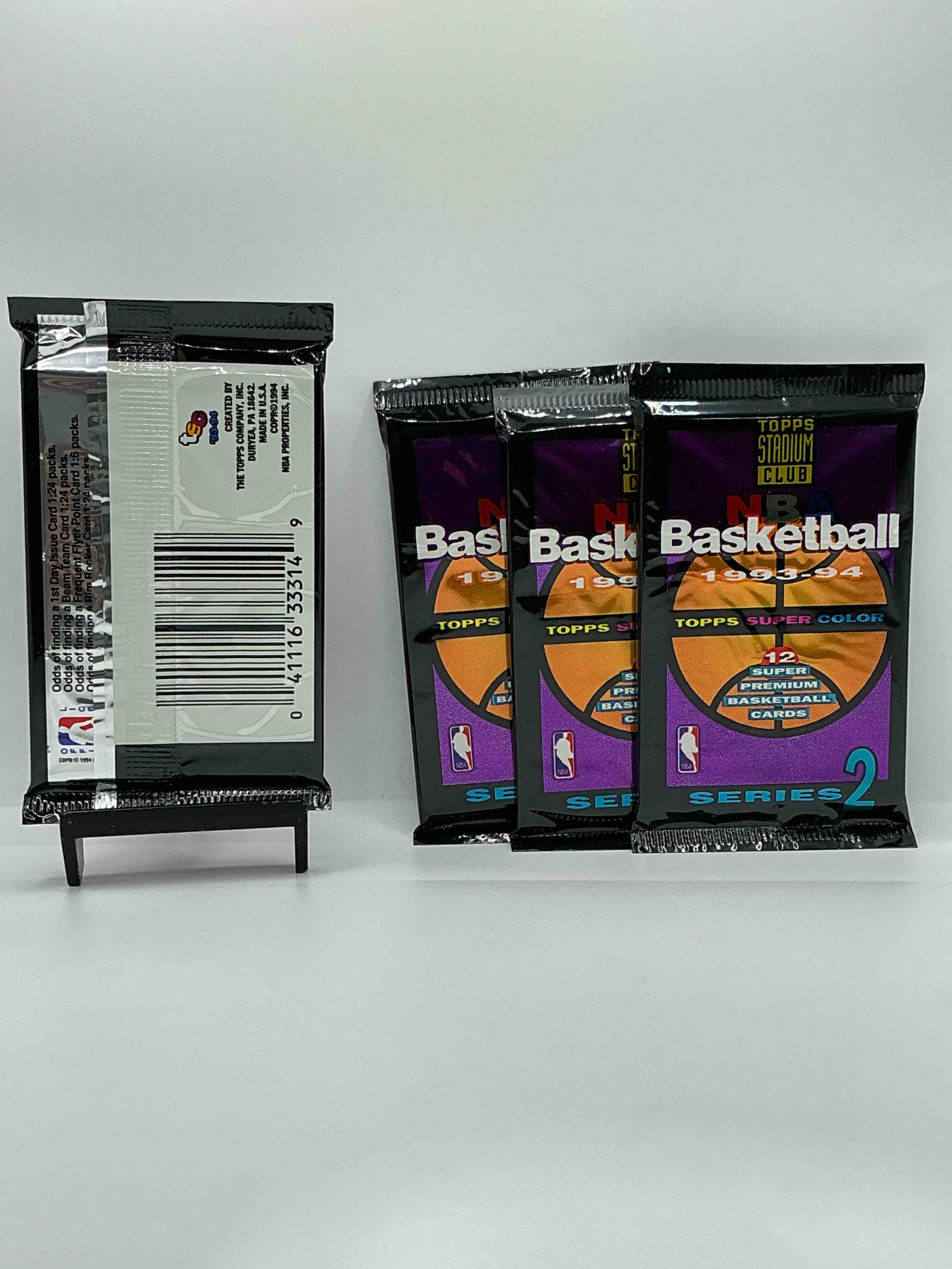 Condition photo showing New/Like New for nba bonanzal 1993- 94 topps stadium club series 2 basketball packs! 12 premium basketball cards in each packl search for legends & rookies alikel look for michael jordan, shag o'nell, hakeem olajuwon & more ist day issue cards, frequent flyer cards, members only cards & rookies from hardaway & webber! possible pippen, magic, jordan, robinson, shaq, olajuwon, ewing & so much more!
