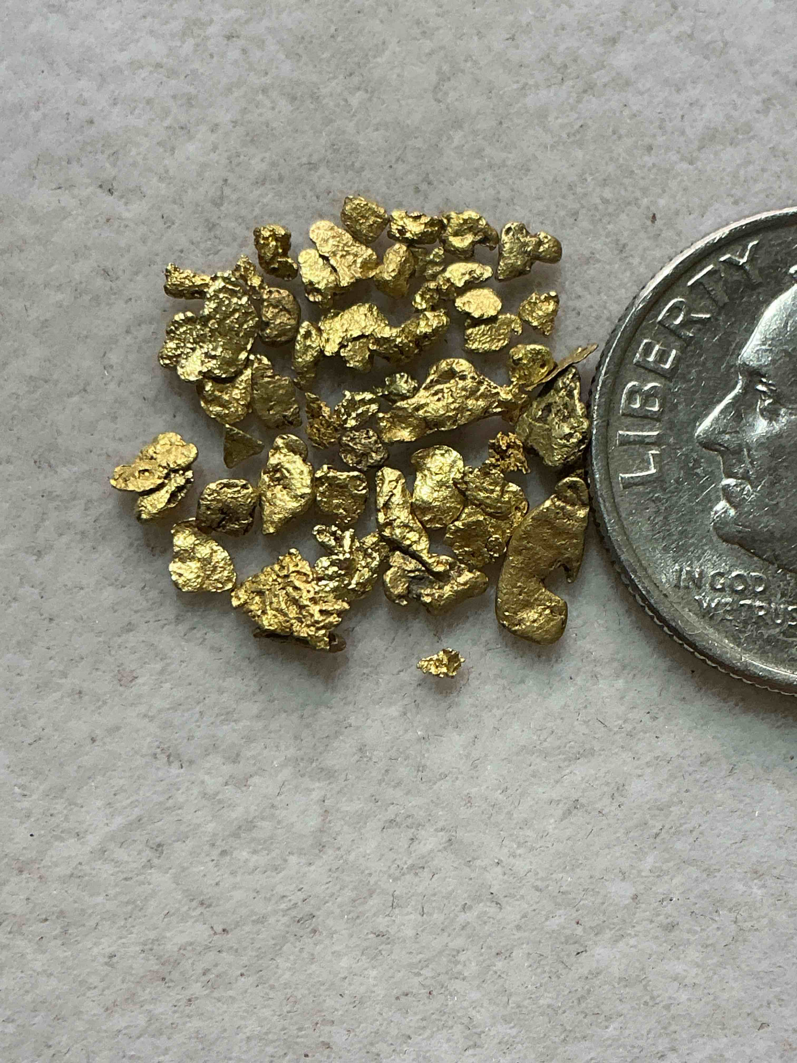 Condition photo showing New/Like New for genuine gold nuggets! approximately 1 gram of prospected gold nuggets! gold nuggets fresh from prospecting north carolina mountains, total weight of all nuggets is approximately 1 gram! these gold nuggets test at between approx 22-24 karat. gold in raw, prospected form is extremely hard to find & much rarer than any refined form. get in on the gold craze... gold has increased in value over 40% since 2025! u.s. dime for size reference only (not included). case in image included. own genuine, gold nuggets!