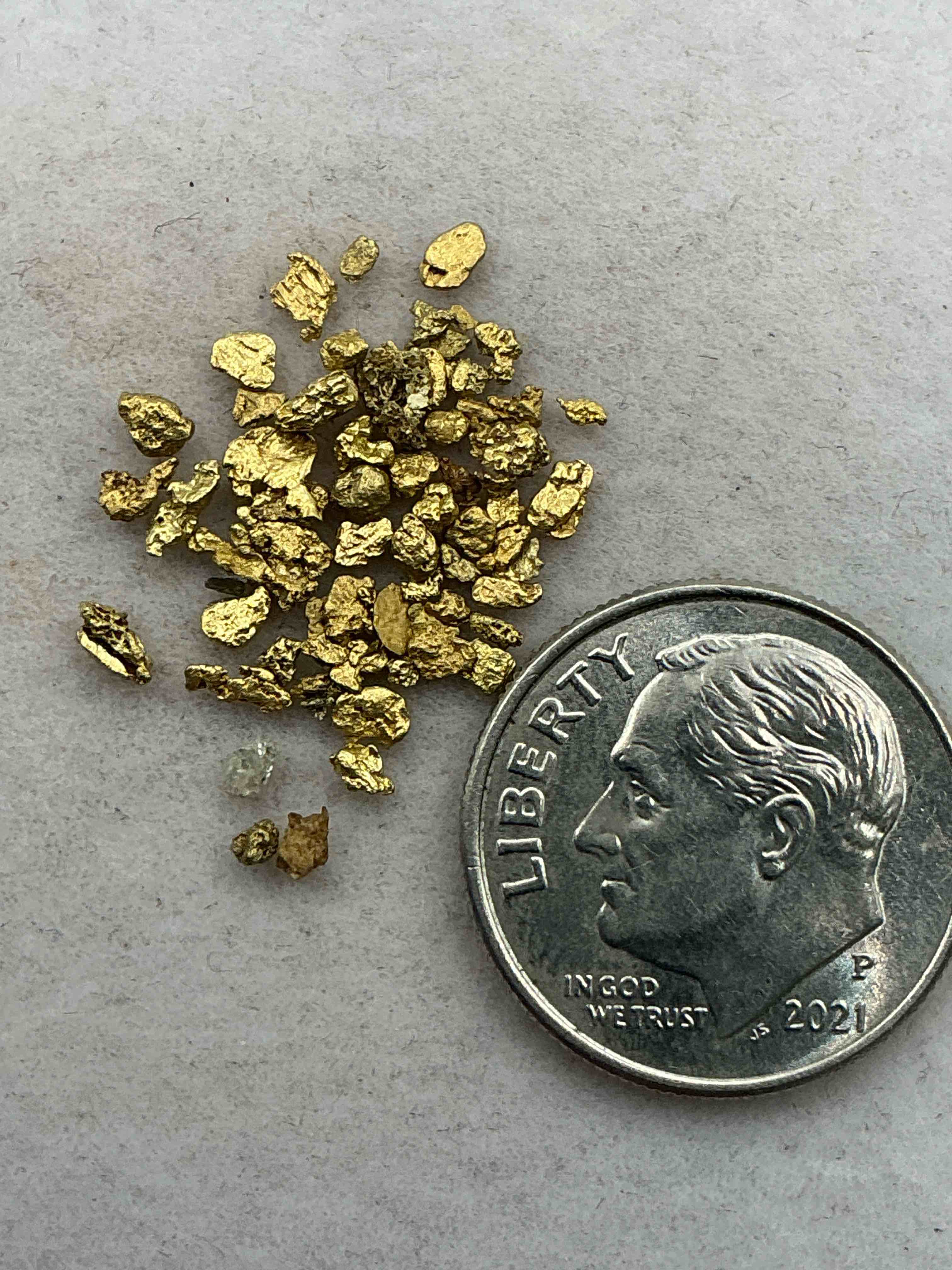 Condition photo showing Good Condition for genuine gold nuggets!  approximately 1 gram of prospected gold nuggets! gold nuggets fresh from prospecting north carolina mountains, total weight of all nuggets is approximately 1 gram! these gold nuggets test at between approx 22-24 karat. gold in raw, prospected form is extremely hard to find & much rarer than any refined form. get in on the gold craze... gold has increased in value over 40% since 2025! u.s. dime for size reference only (not included). case in image included. own genuine, gold nuggets! 
