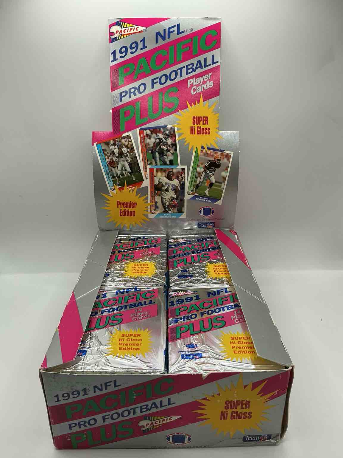 Condition photo showing New/Like New for 1991 pacific football, something you hardly ever see! pacific footbell sealed card pack, direct from original retail case. search for brett favre rookie, barry sanders, jerry rice & so much more! hard to find!