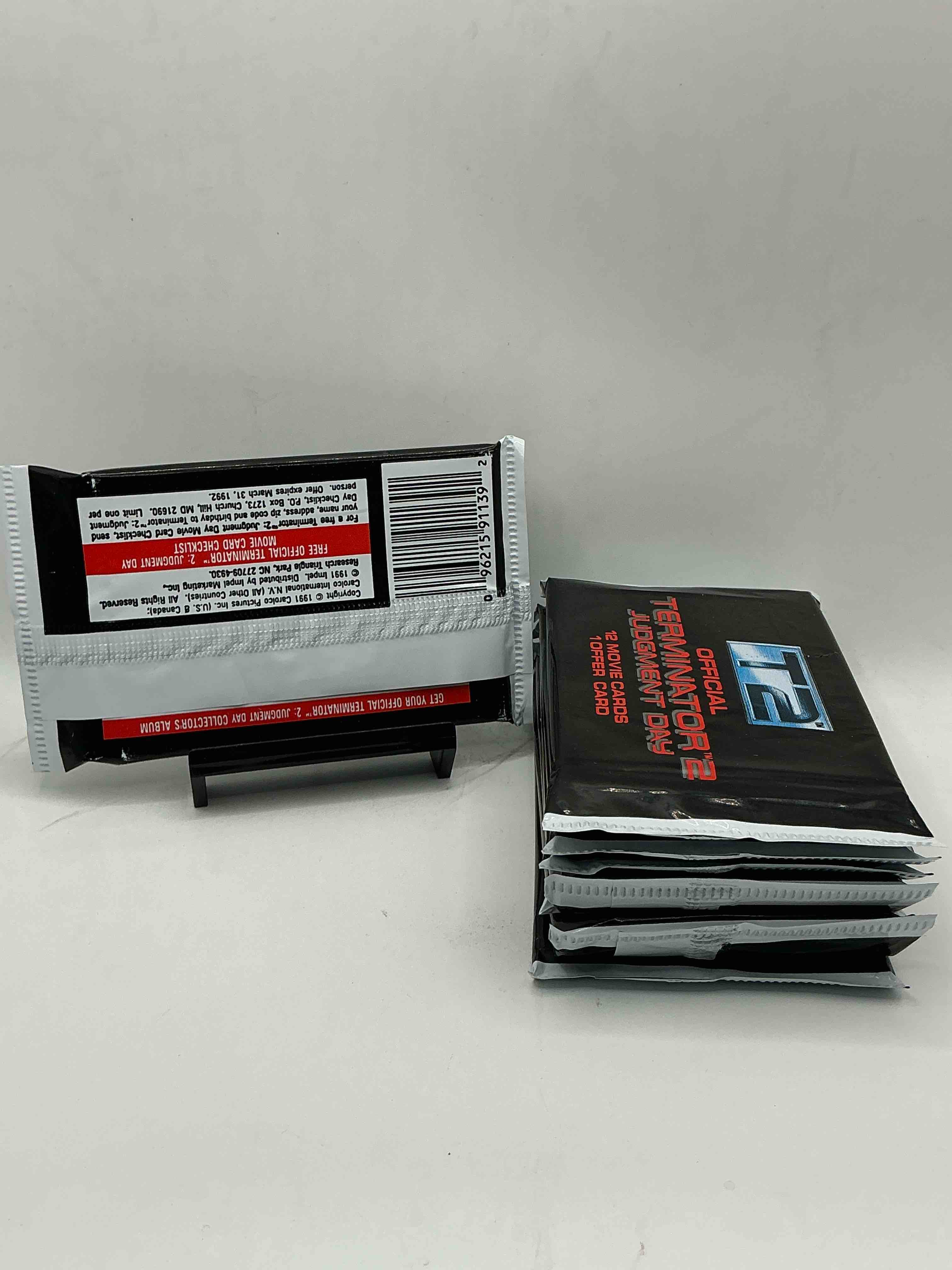 Condition photo showing New/Like New for terminator 2 packs! direct from box unopened 1991 terminator 2 movie card packs, 12 cards per pack! pack galore! check out these rare movie cards from 1991!