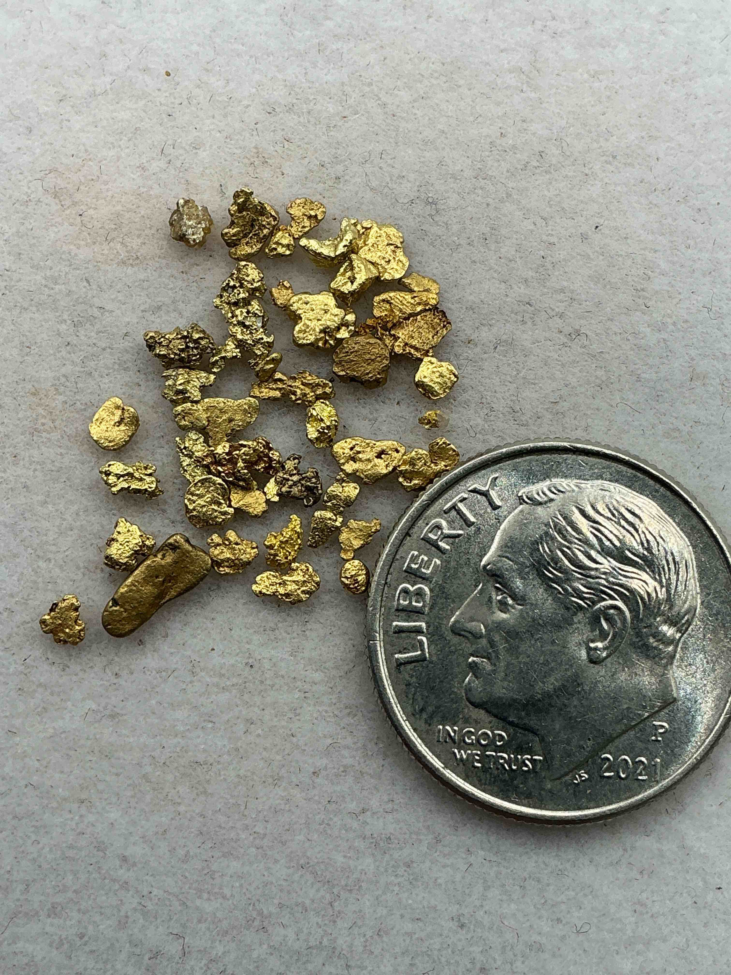 Condition photo showing Good Condition for genuine gold nuggets! approximately 1 gram of prospected gold nuggets! gold nuggets fresh from prospecting north carolina mountains, total weight of all nuggets is approximately 1 gram! these gold nuggets test at between approx 22-24 karat. gold in raw, prospected form is extremely hard to find & much rarer than any refined form. get in on the gold craze... gold has increased in value over 40% since 2025! u.s. dime for size reference only (not included). case in image included. own genuine, gold nuggets!