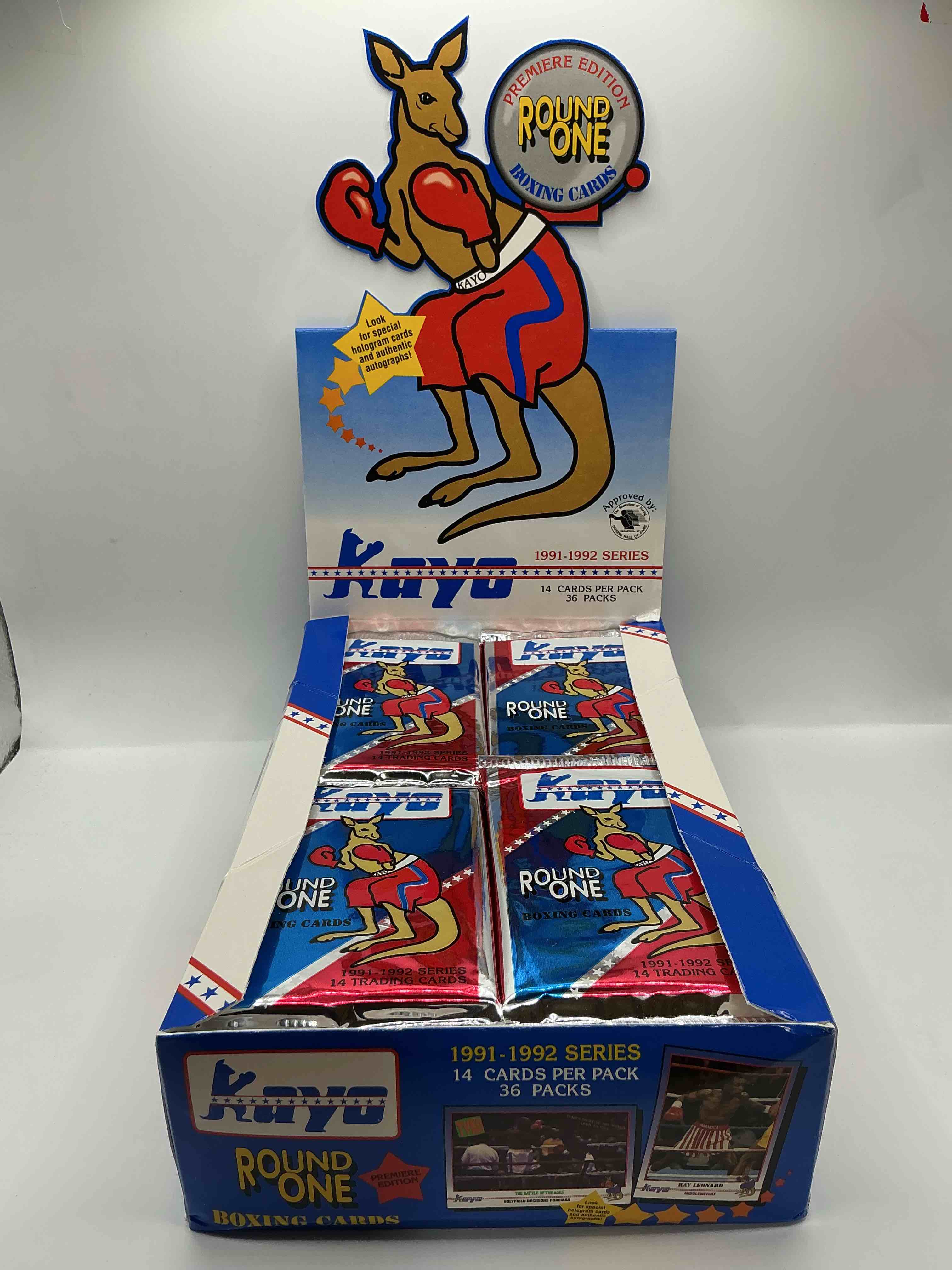 Condition photo showing New/Like New for 1991-92 kayo round one boxing cards! 14 cards per pack! look for roy jones jr, lennox lewis, james toney & more! beautiful packs!