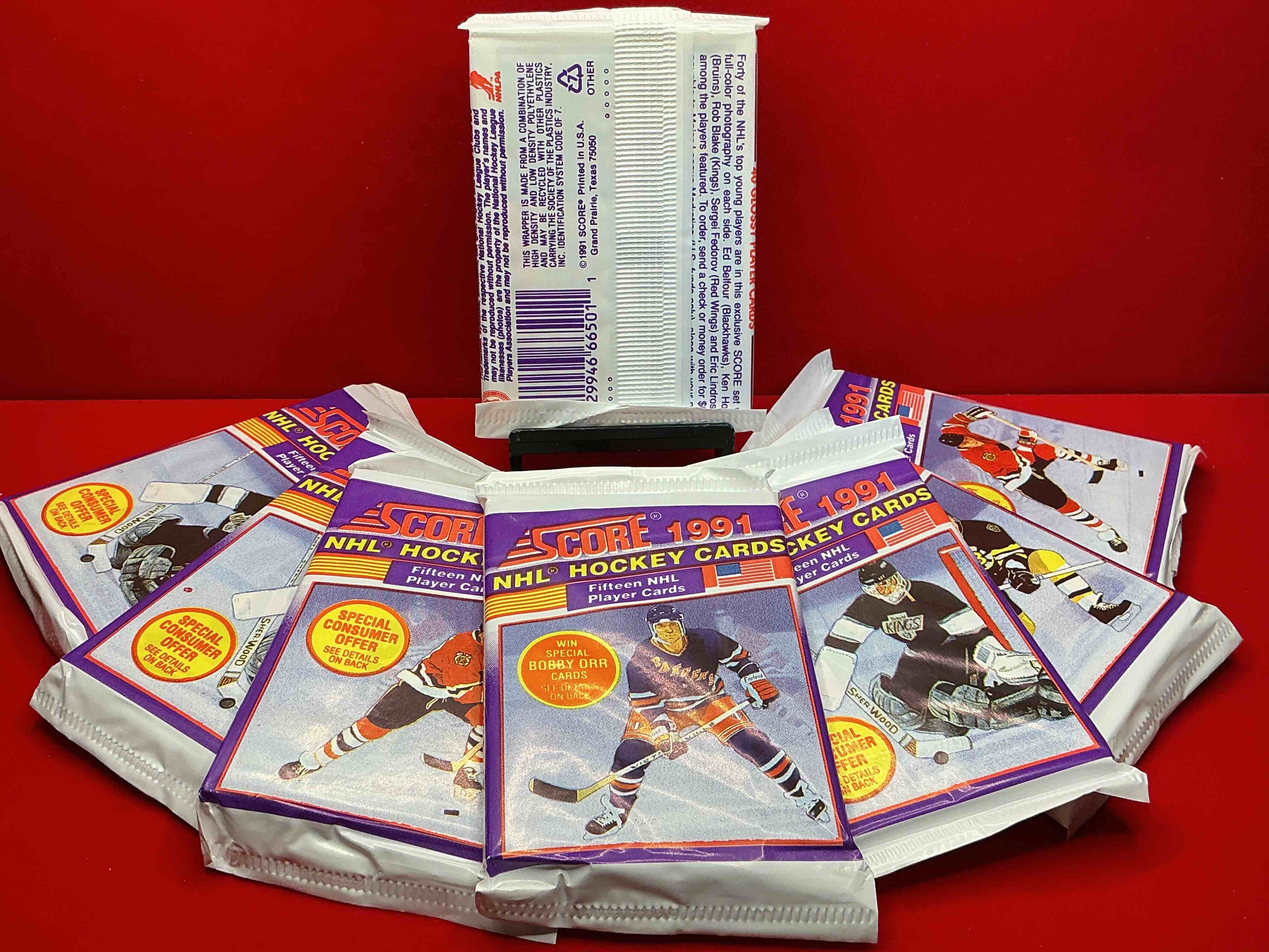 Condition photo showing New/Like New for hockey insanity! wow! 1991-92 nhl score 15 cards per pack! look for all of your favorite stars from the 90’s in these rare packs!