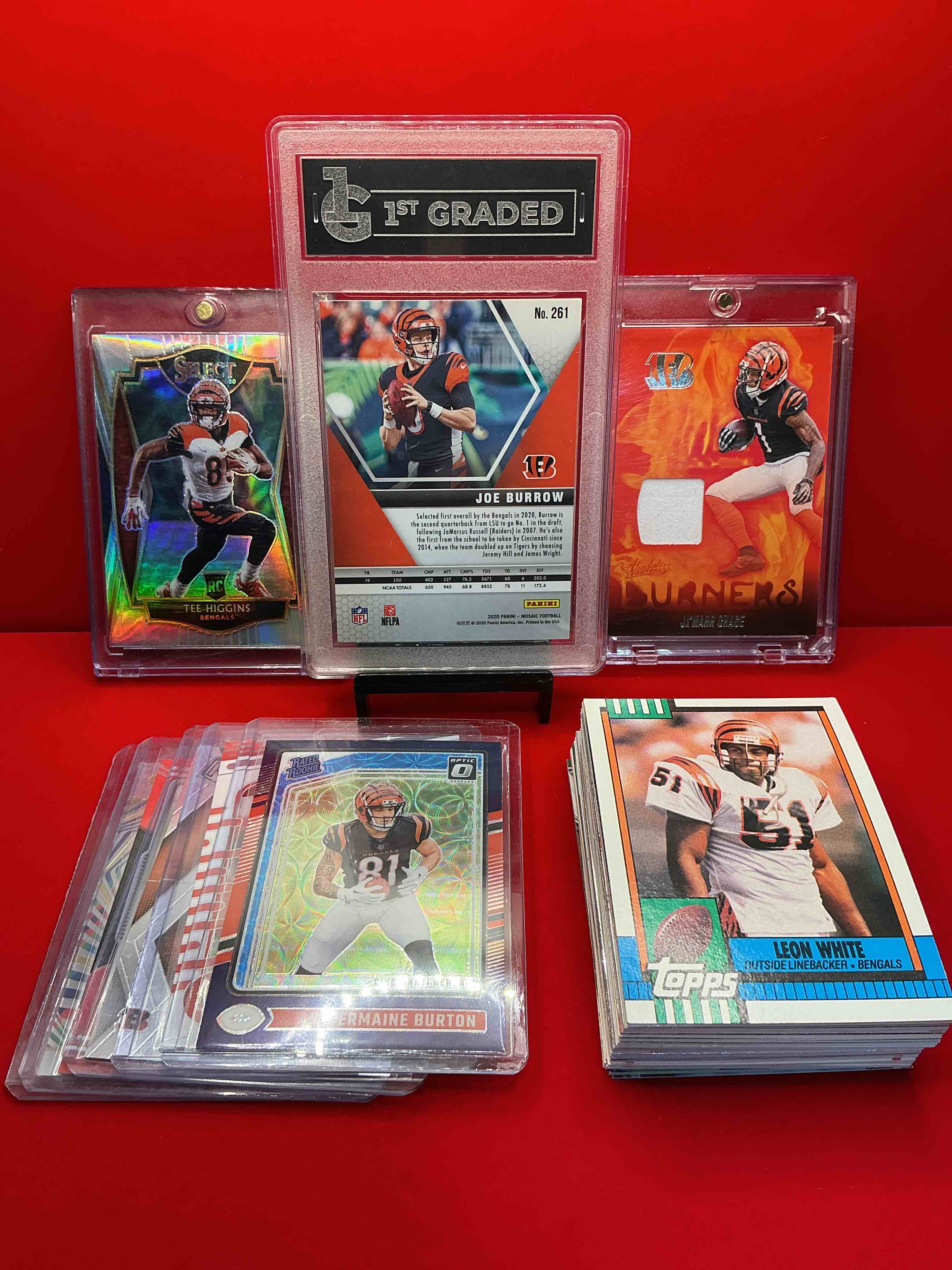 Condition photo showing New/Like New for gem mint 10 rookie joe burrow! ja’marr chase! tee higgins! also included is 50 other common & rare bengals players throughout the years