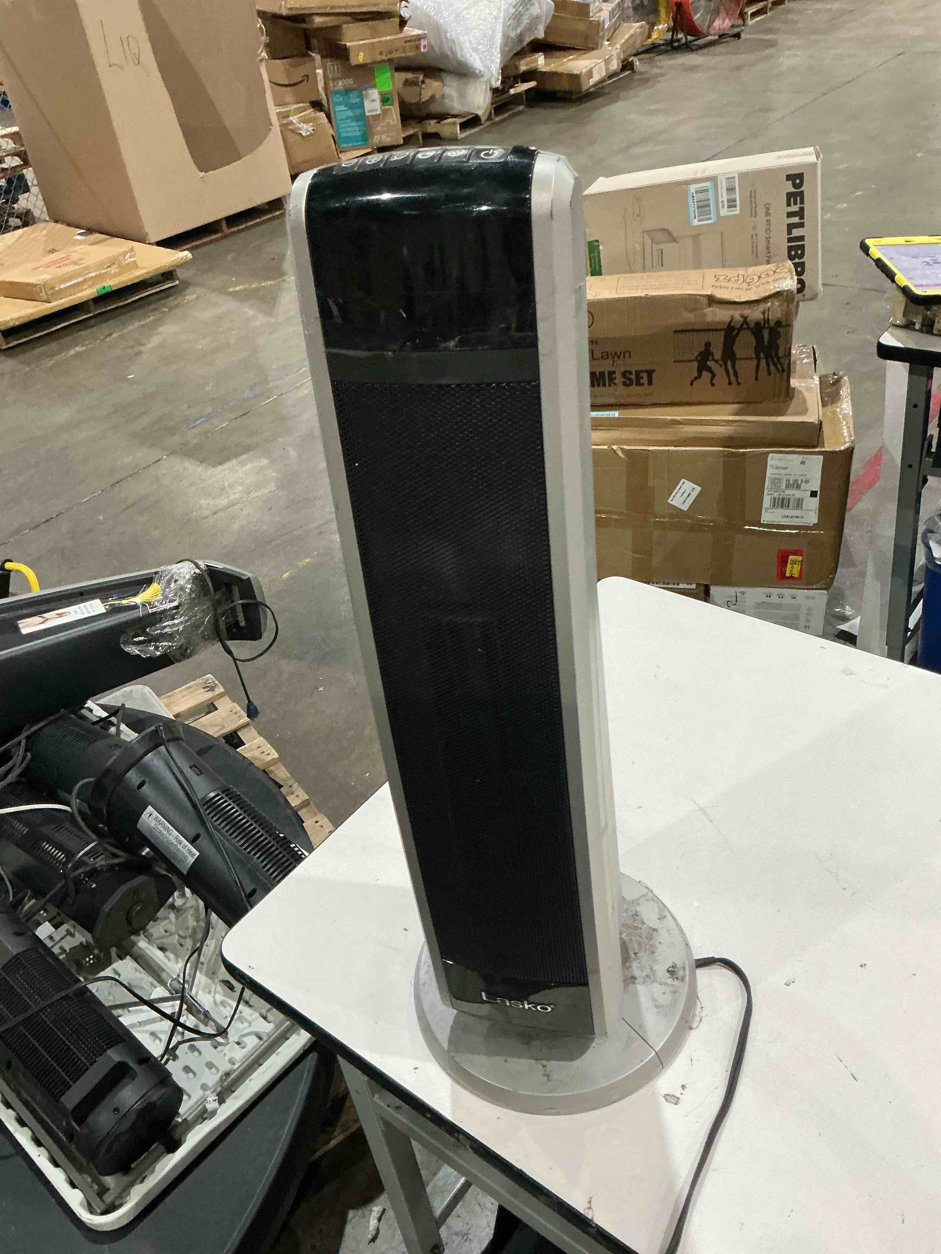 Condition photo showing As Is for lasko space heater 