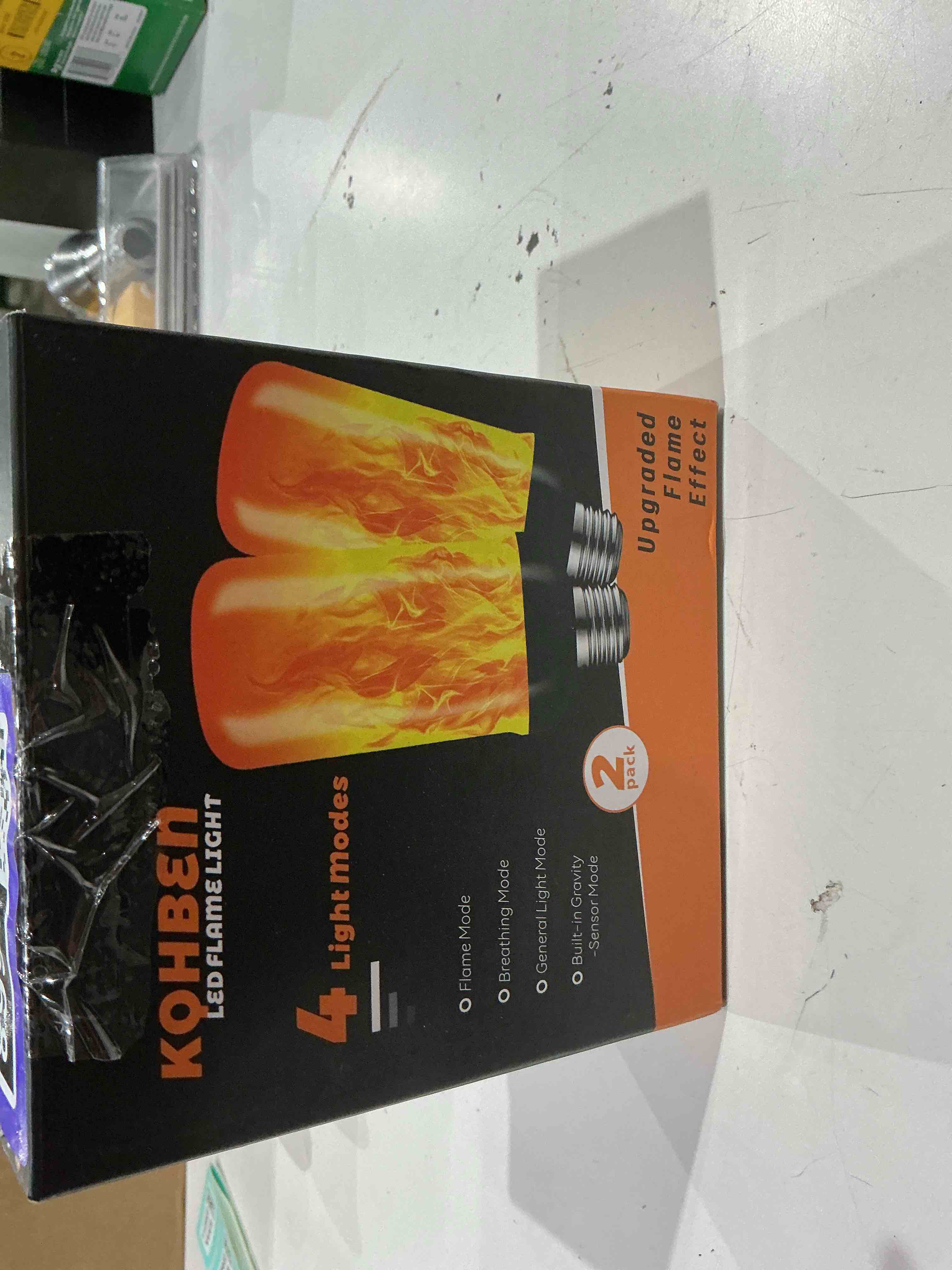 Condition photo showing As Is for led flame light bulbs, flickering light bulbs 4 modes with gravity sensor, e26 base fire light bulb for halloween, christmas,porch, patio, party, indoor outdoor decor orange