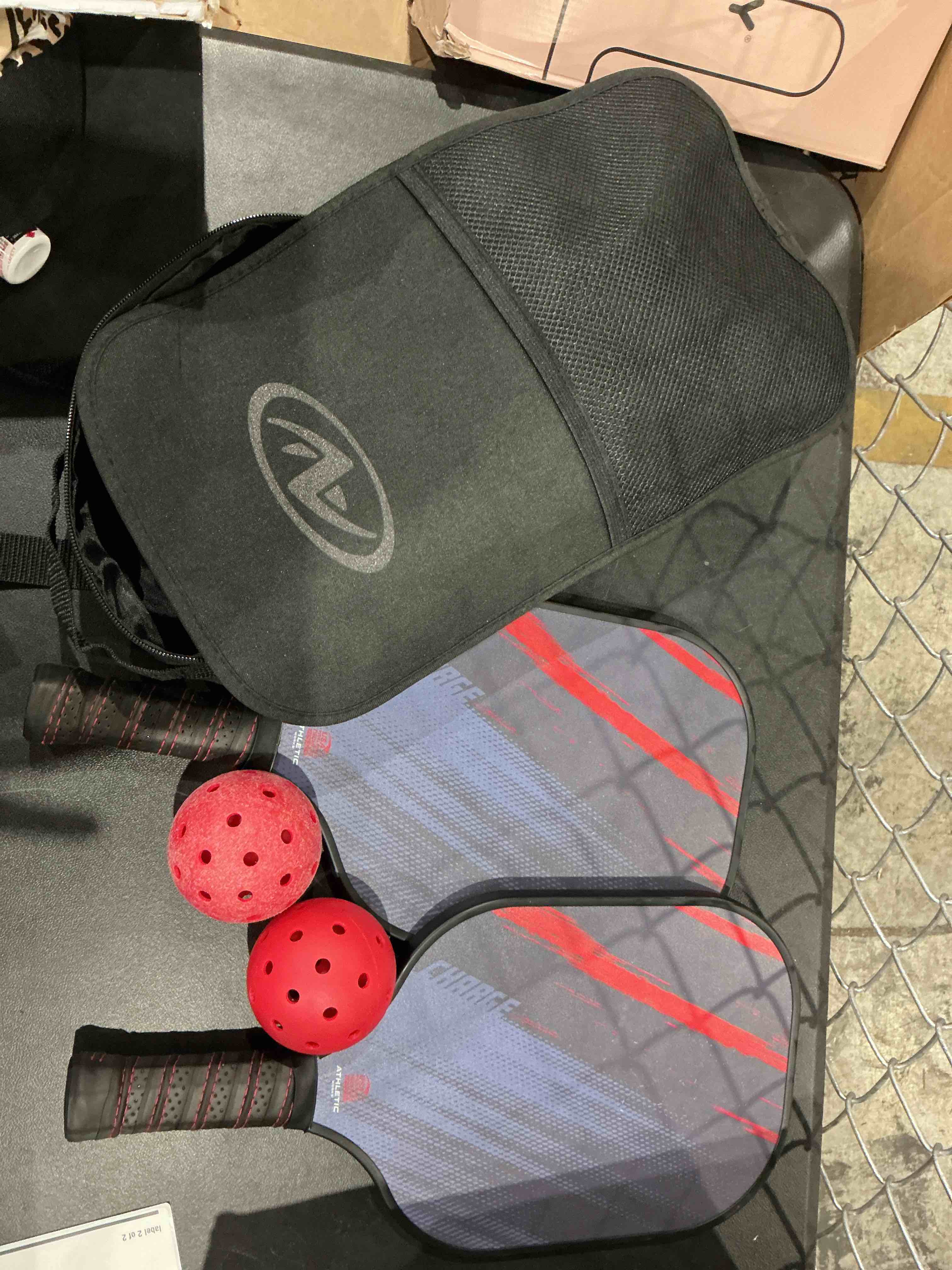 Condition photo showing As Is for athletic works charge fiberglass 2-player pickleball paddle set, includes 2 paddles/2 pickleballs/carry bag