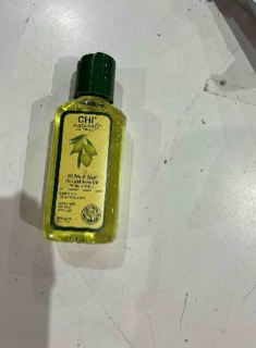 Condition photo showing Good Condition for chi olive organics hair and body oil unisex 2 oz