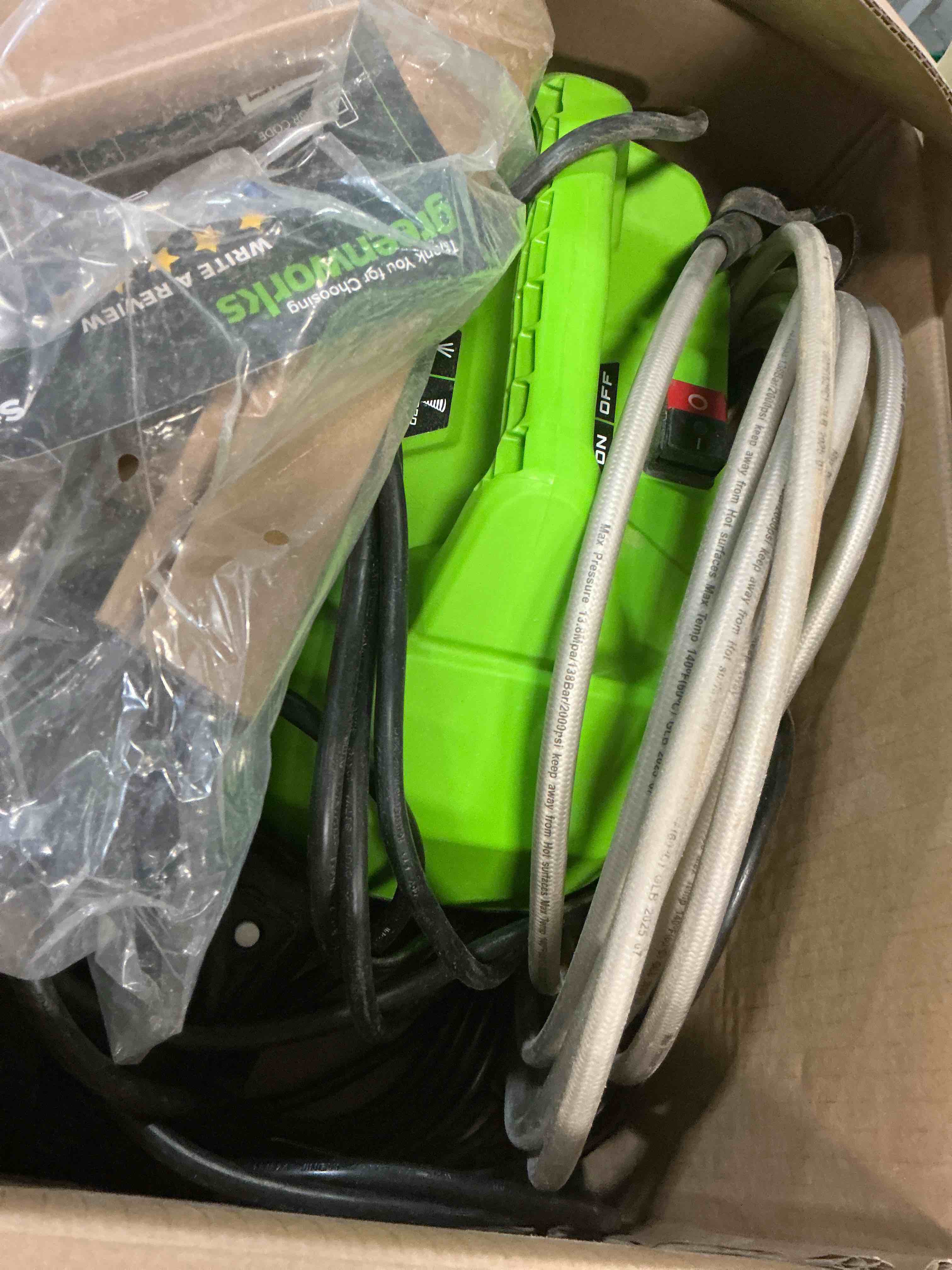 Condition photo showing As Is for greenworks 1800-psi 1.2-gpm cold water electric pressure washer with 2 spray tips