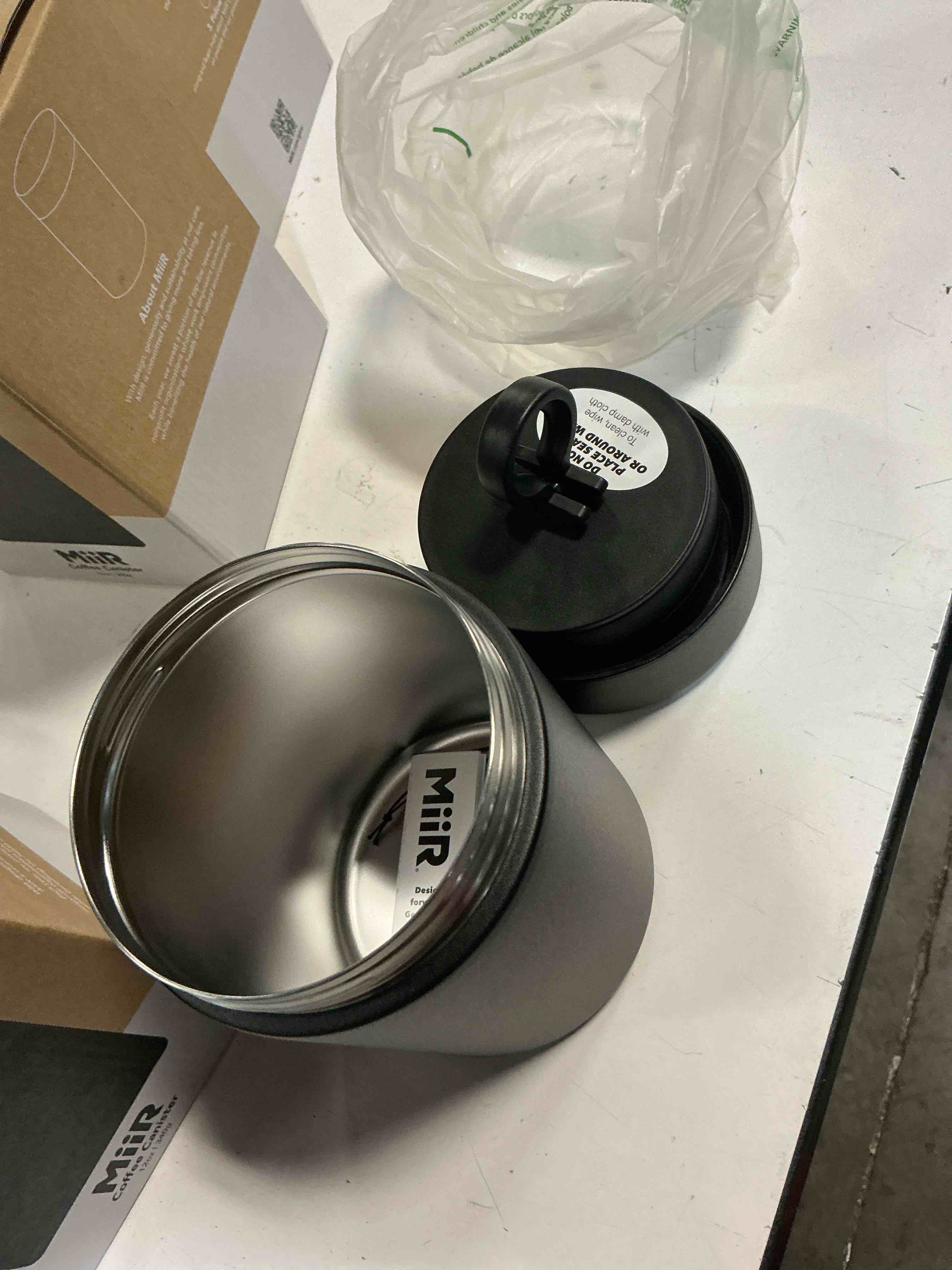 Condition photo showing Good Condition for miir airlock coffee canister, 12-oz capacity, 18/8 stainless steel, 90% recycled content, sleek minimalist design, black