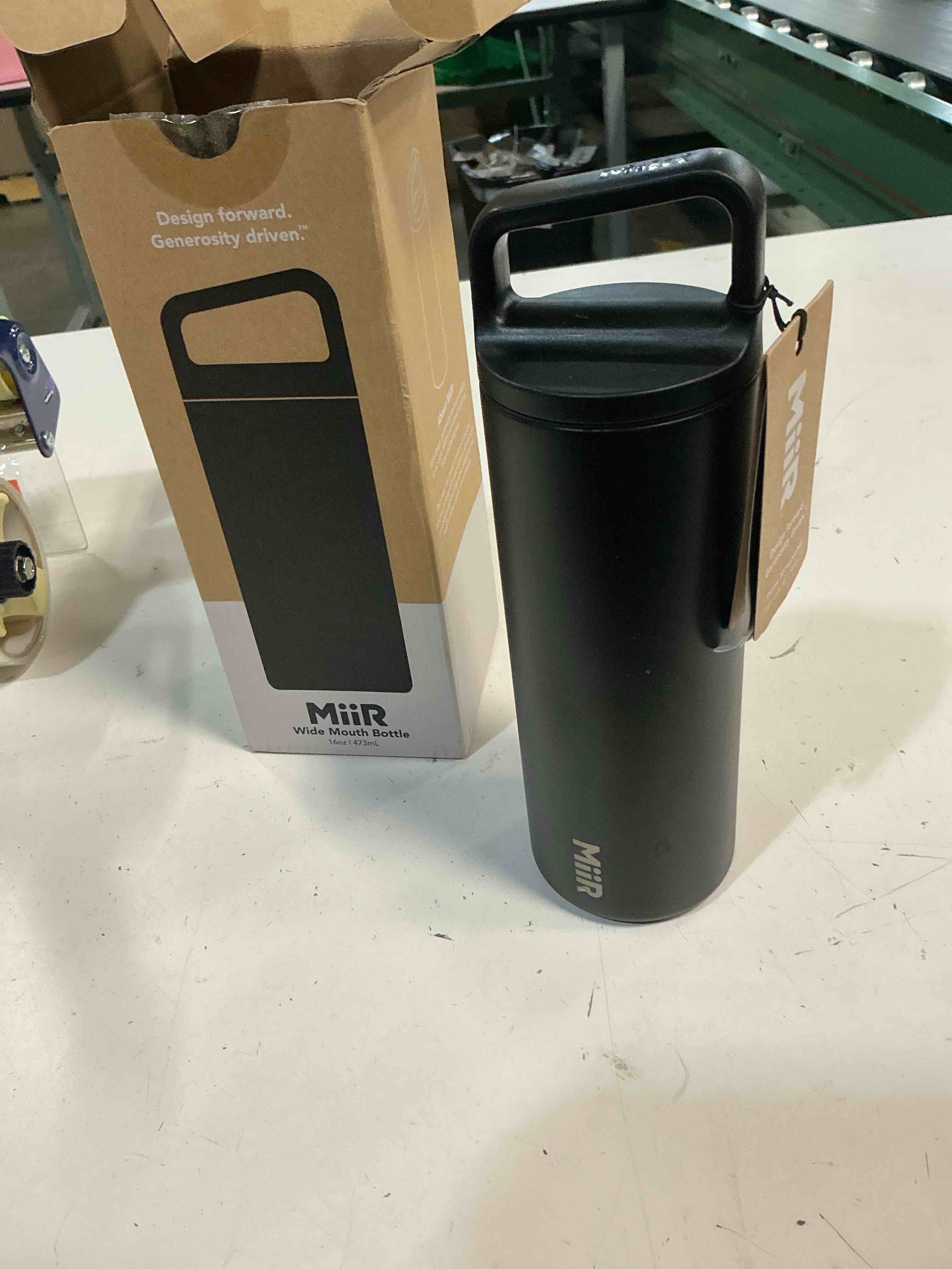 Condition photo showing New/Like New for miir, wide mouth water bottle, vacuum insulated leakproof, stainless steel construction, black, 16 oz