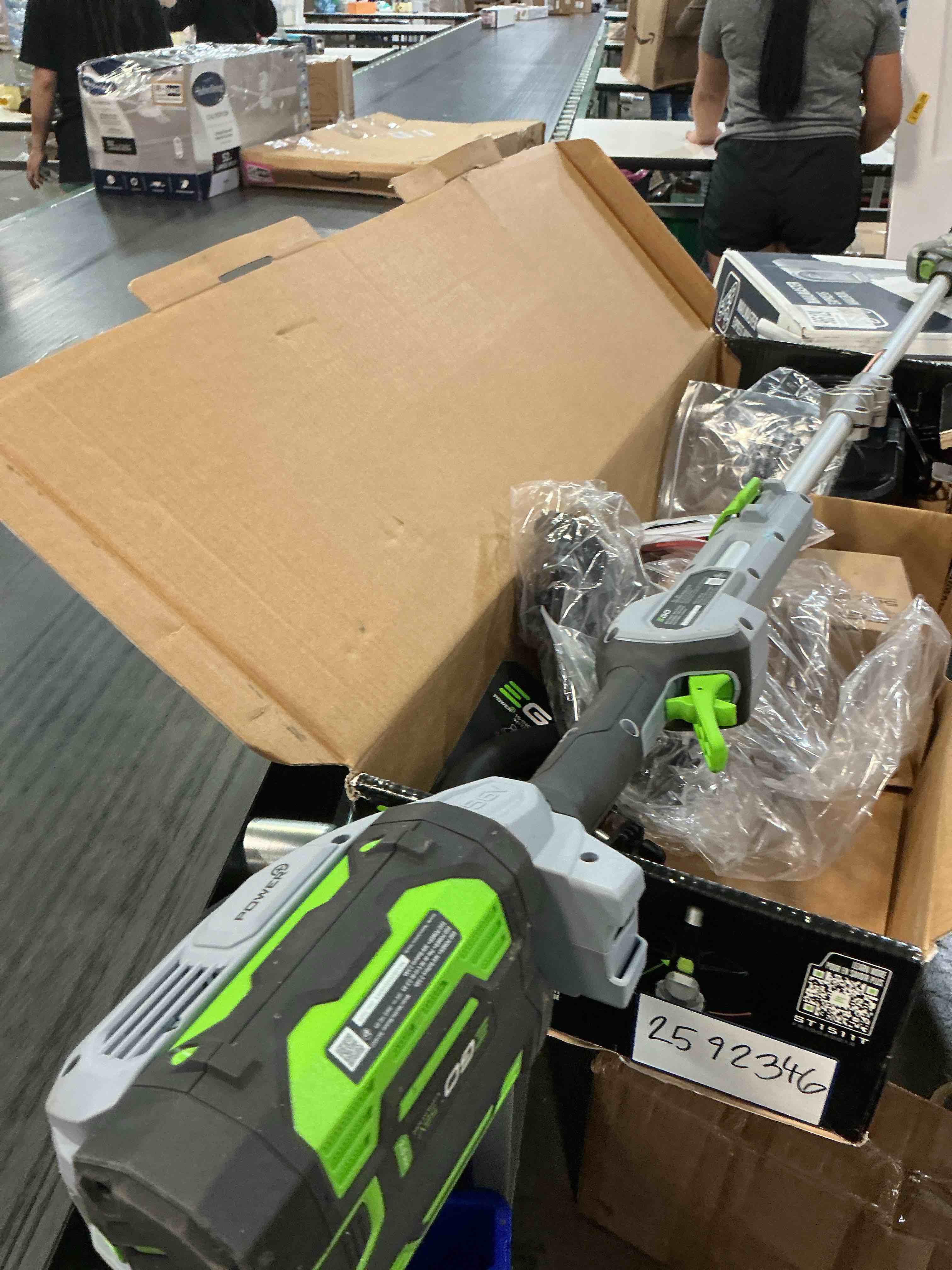 Condition photo showing As Is for ego st1511t 15-inch 56-volt lithium-ion cordless string trimmer kit alu foldable shaft battery and charger included, 15in powerload/telescopic/gauge(2.5ah), black