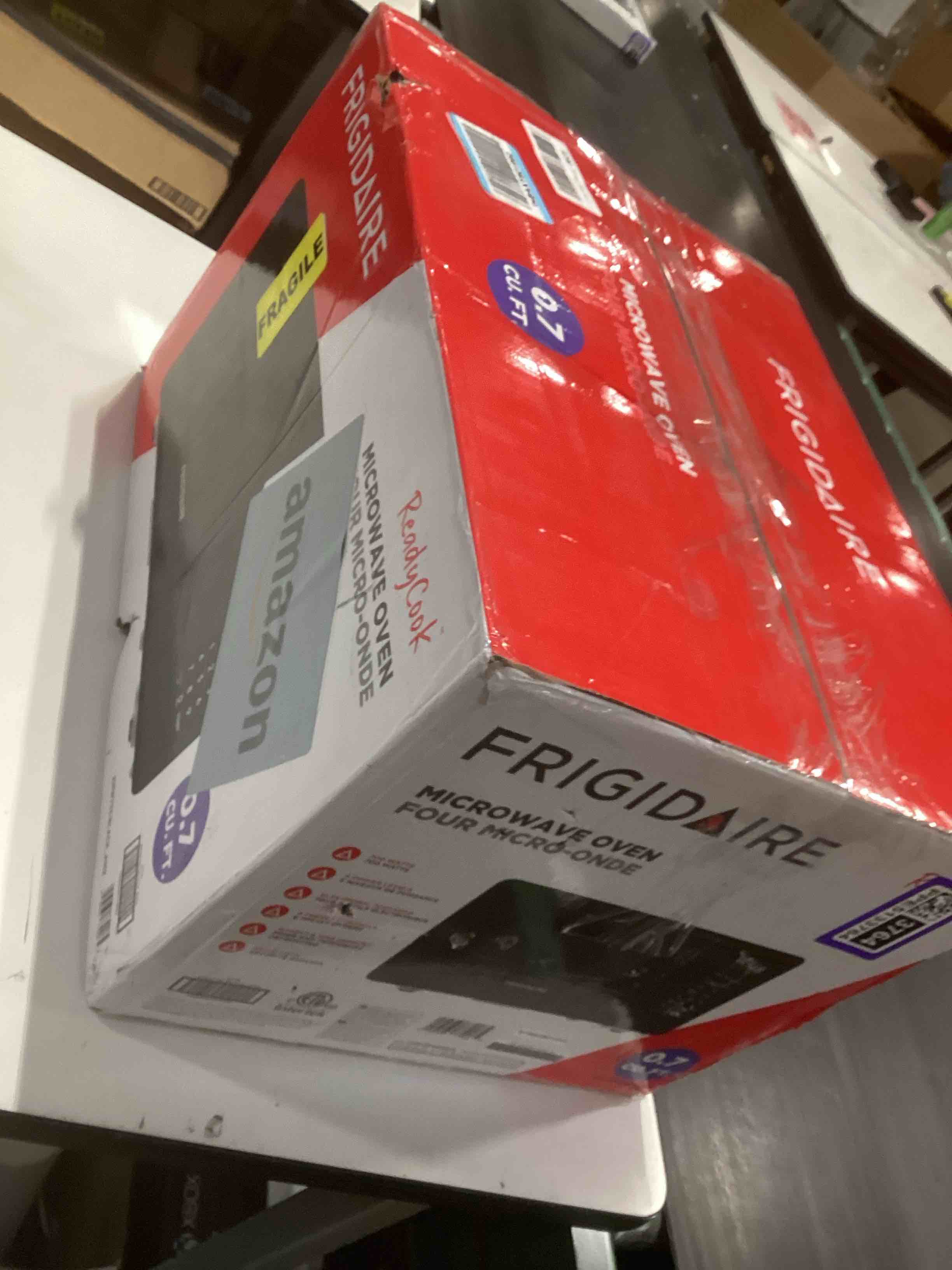Condition photo showing As Is for frigidaire emw733blackamz 0.7 cu. ft. microwave, black