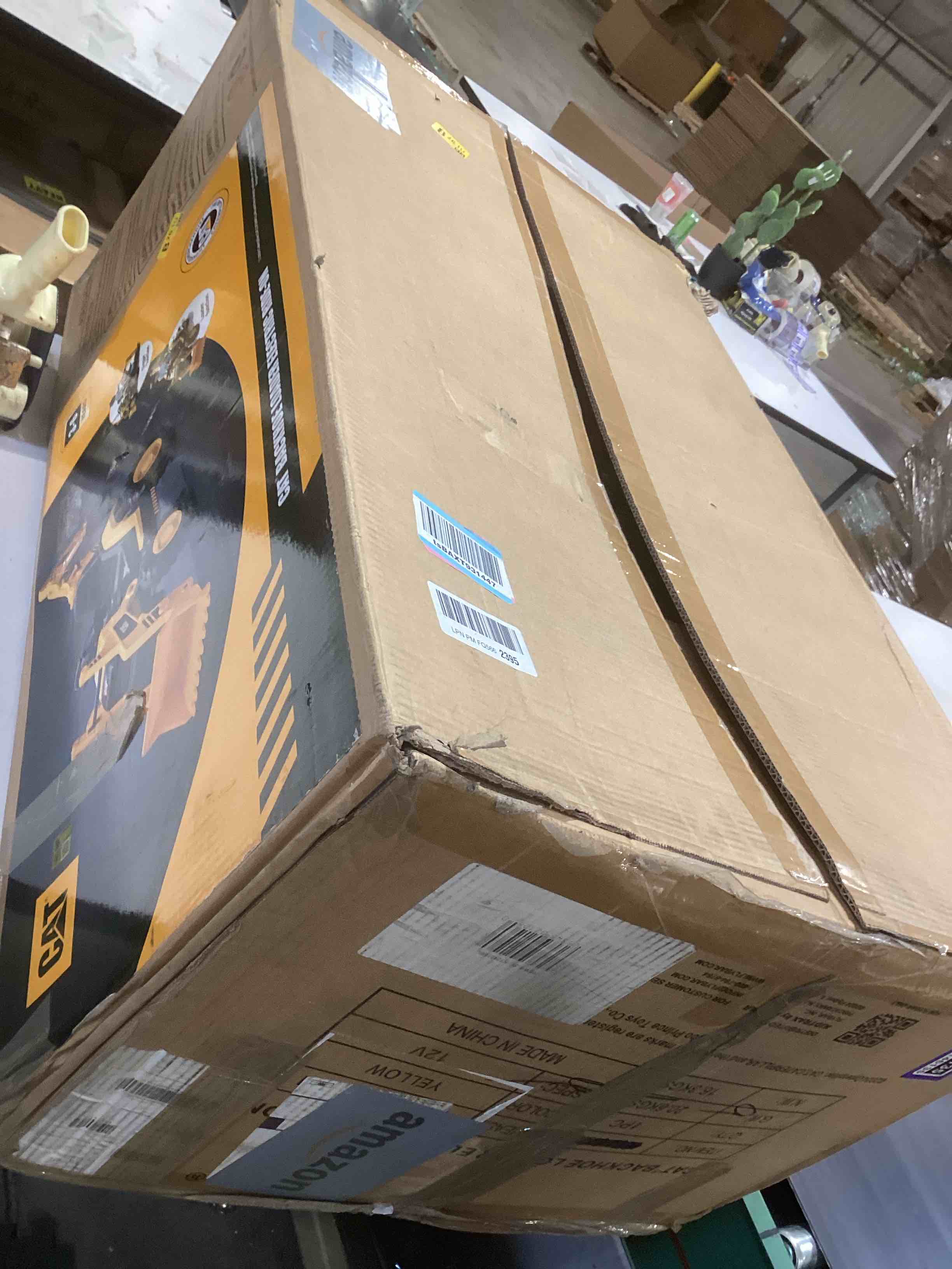 Condition photo showing As Is for kid trax 12v cat backhoe loader - ride on excavator construction toys for boys w/realistic sounds, 2.5-5 mph mini bulldozer, indoor/outdoor tractor toys, sturdy toy cars for toddlers 3-6, up to 66lbs 12v backhoe loader