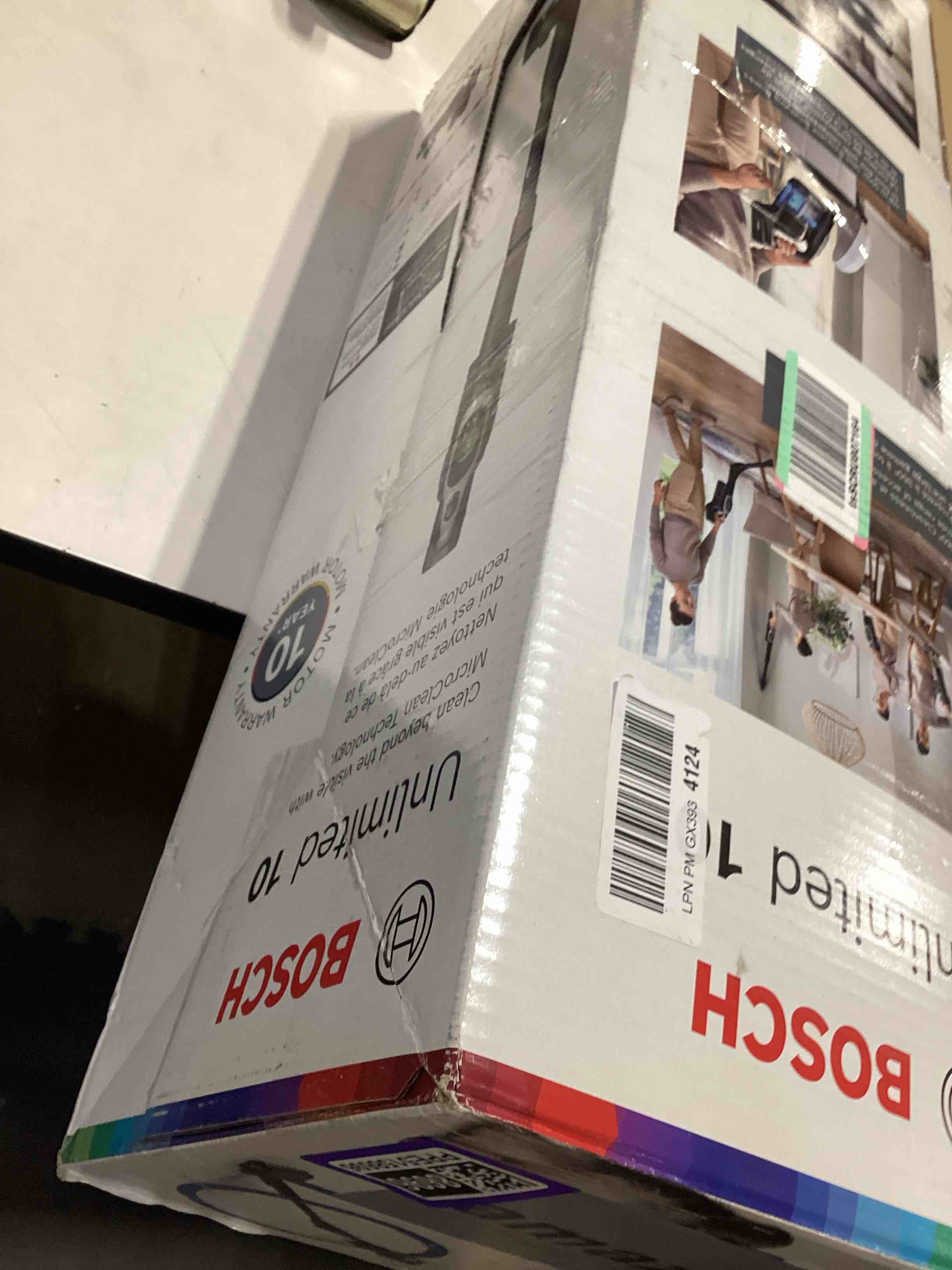 Condition photo showing As Is for bosch unlimited 10 cordless stick vacuum, up to 80-min runtime, 90° flex tube, fast charger, microclean, >99.9% dust pick-up, hepa filter, pet hair, carpets & hard floors, 6 accessories, black