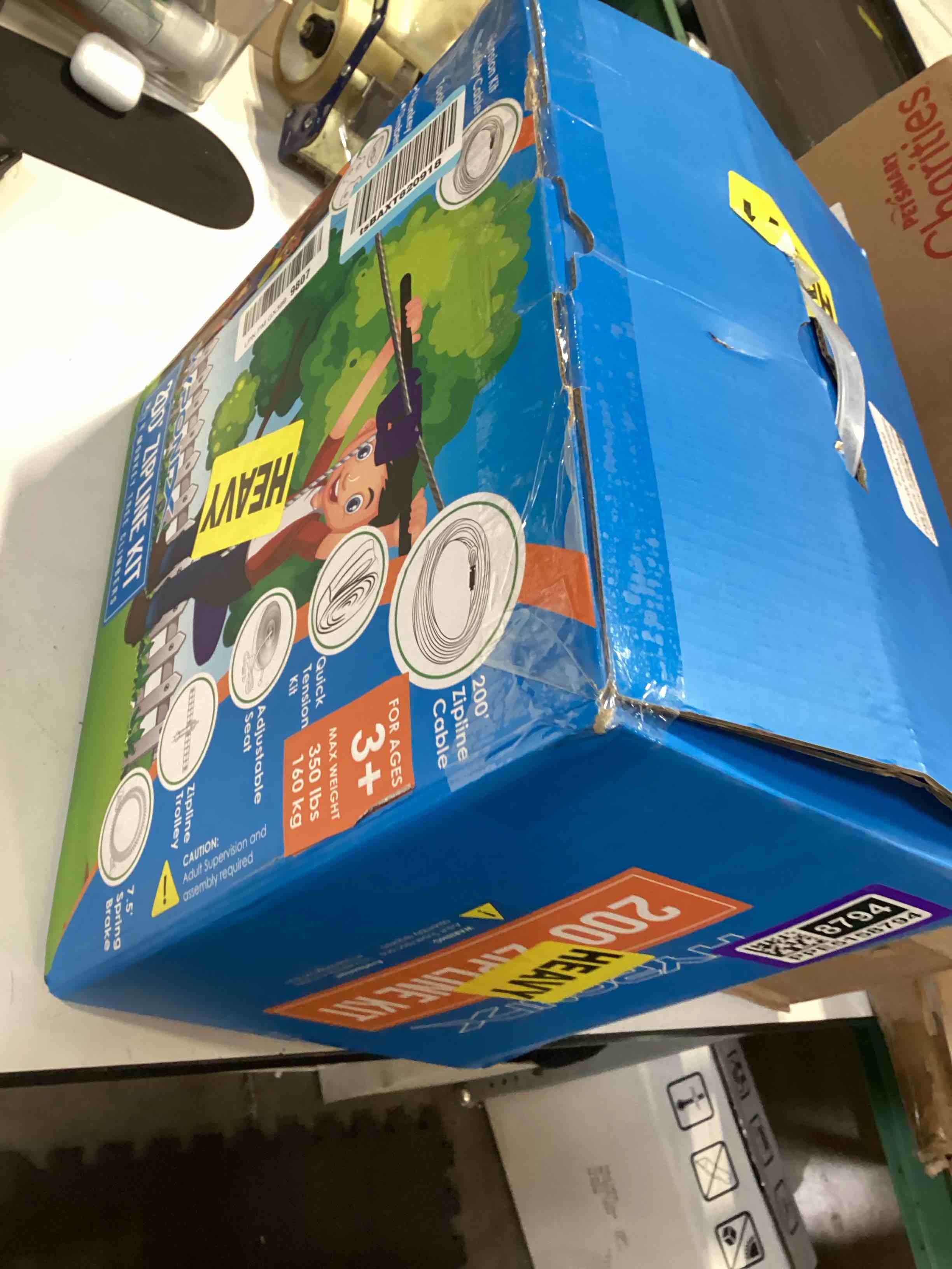 Condition photo showing As Is for zip line kit for kids and adults, 100/120/150/200 ft, up to 350 lbs, removable trolley, rustproof stainless steel, quick setup with ratchet, safety harness, backyard adventure fun w/climbing holds 200' zipline kit