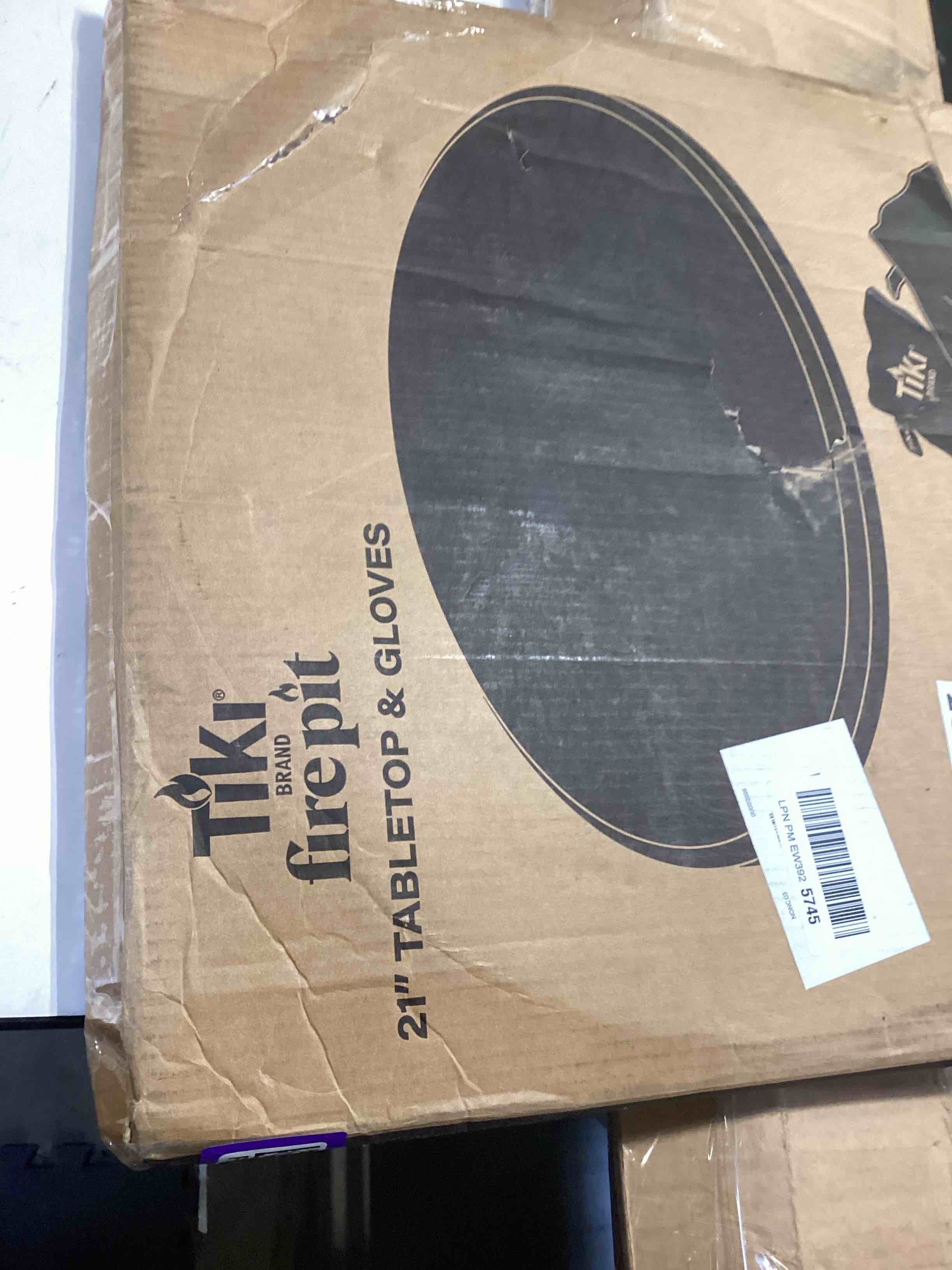 Condition photo showing Good Condition for tiki social & huddle tabletop fire pit cover - 21" durable powder coated steel lid - weather-resistant outdoor fire pit protection - converts fire pit into table - patio & backyard accessory, gray social fire pit table top cover
