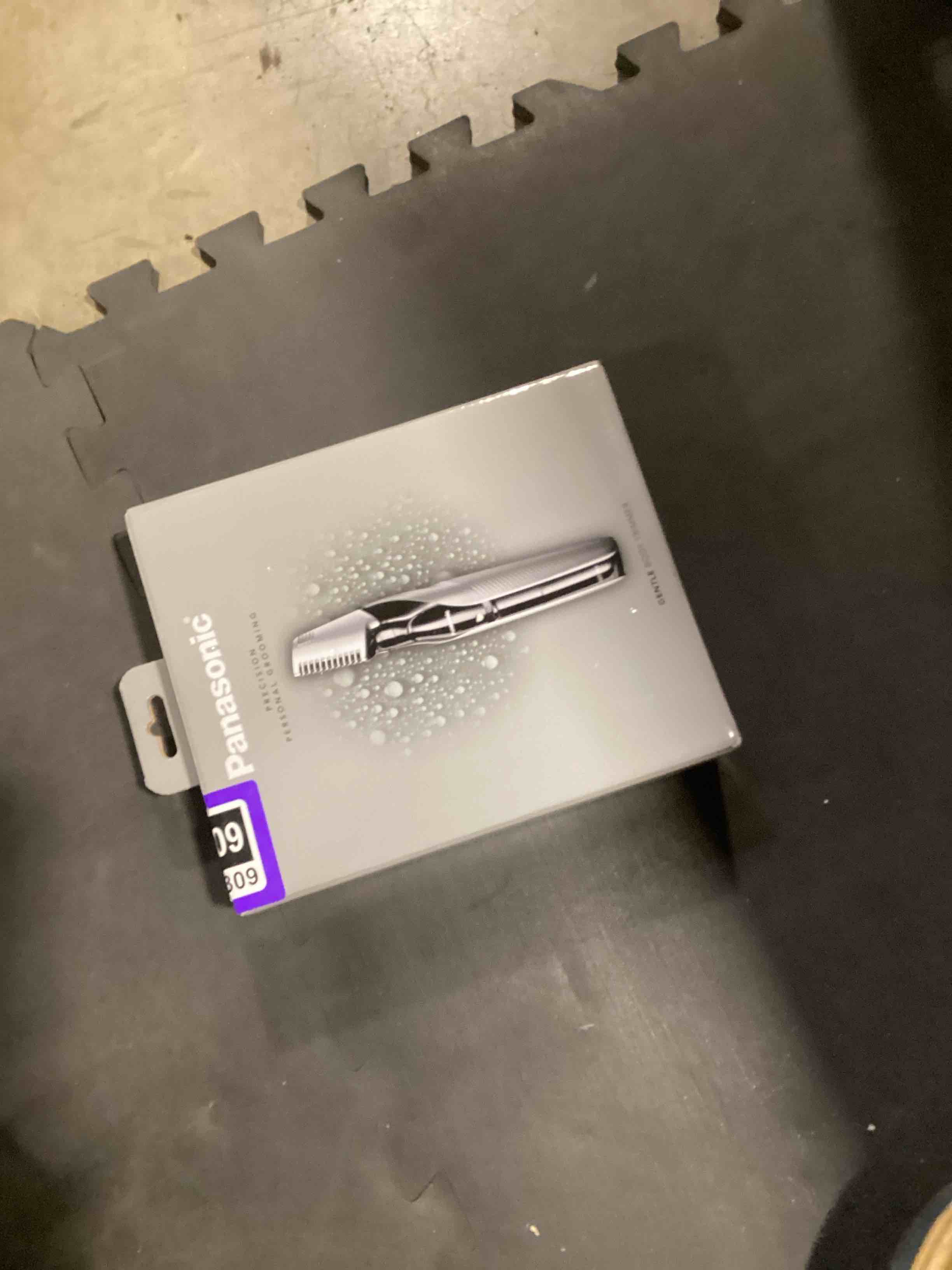 Condition photo showing As Is for panasonic body hair trimmer for men, cordless waterproof design, v-shaped trimmer head with 3 comb attachments for gentle, full body grooming, er-gk60-s (silver) 3 piece set er-gk60-s