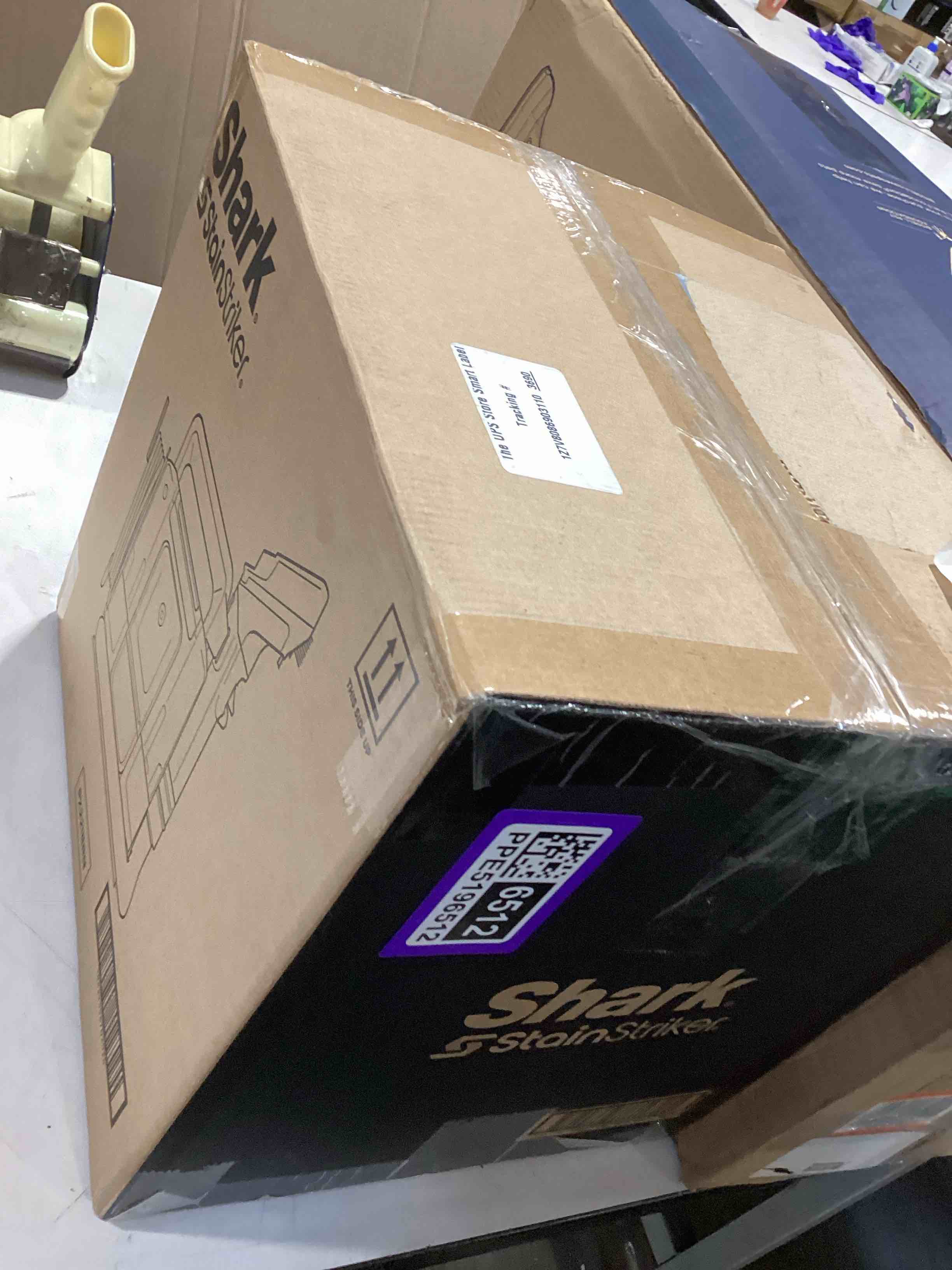 Condition photo showing As Is for shark stainstriker portable carpet & upholstery cleaner w/on board self cleaning - spot, stain, & odor eliminator, includes 2 cleaning tools & 2 cleaning solutions, charcoal, px221brn stainstriker w/ onboard self-cleaning