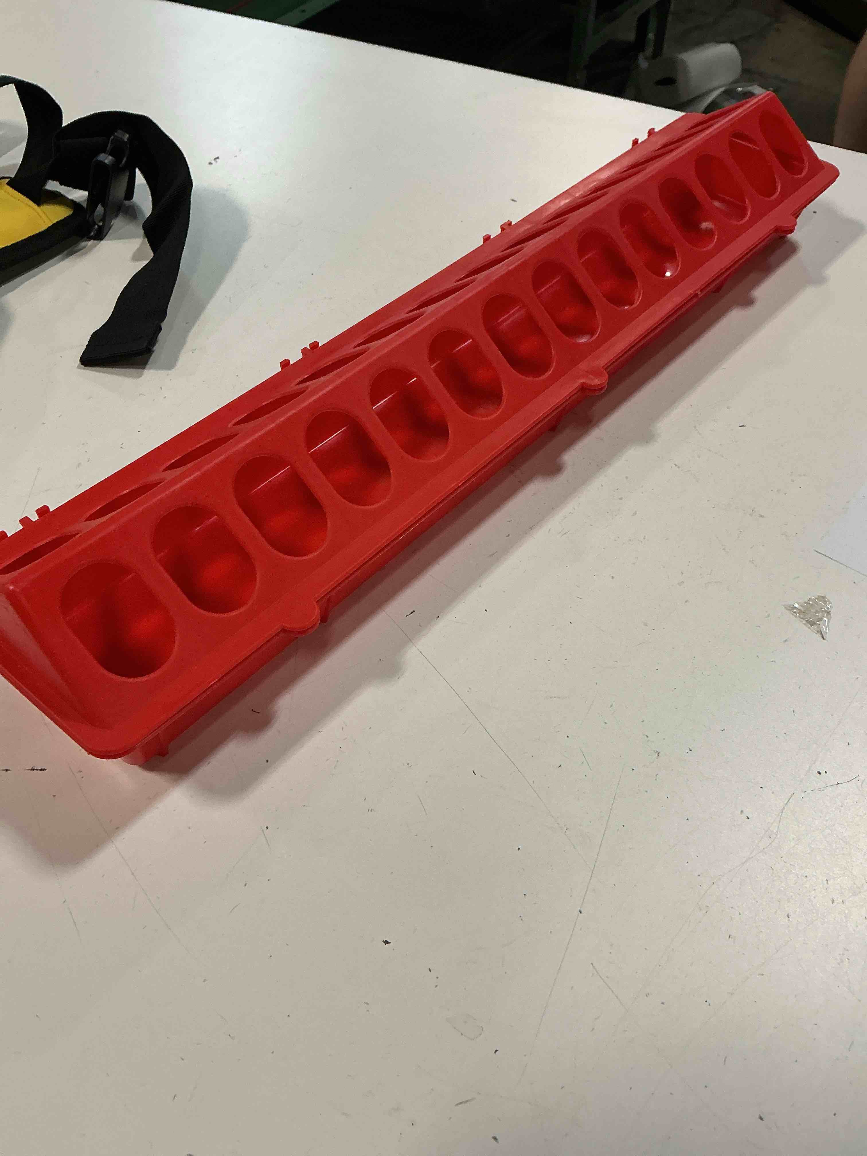 Condition photo showing Good Condition for durable red chicken feeder designed to minimize waste while allowing multiple birds to feed comfortably at once.