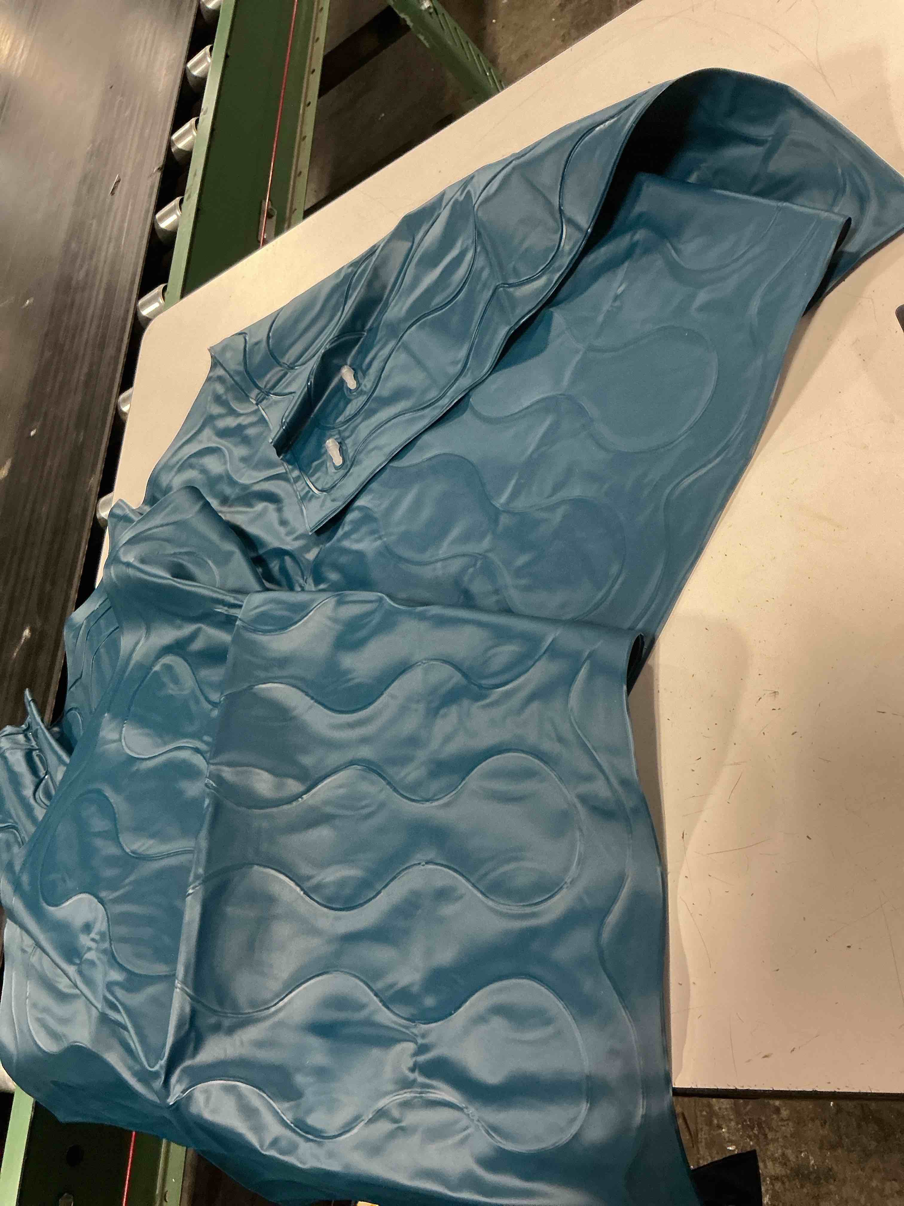 Condition photo showing As Is for teal long pool float inflatable
