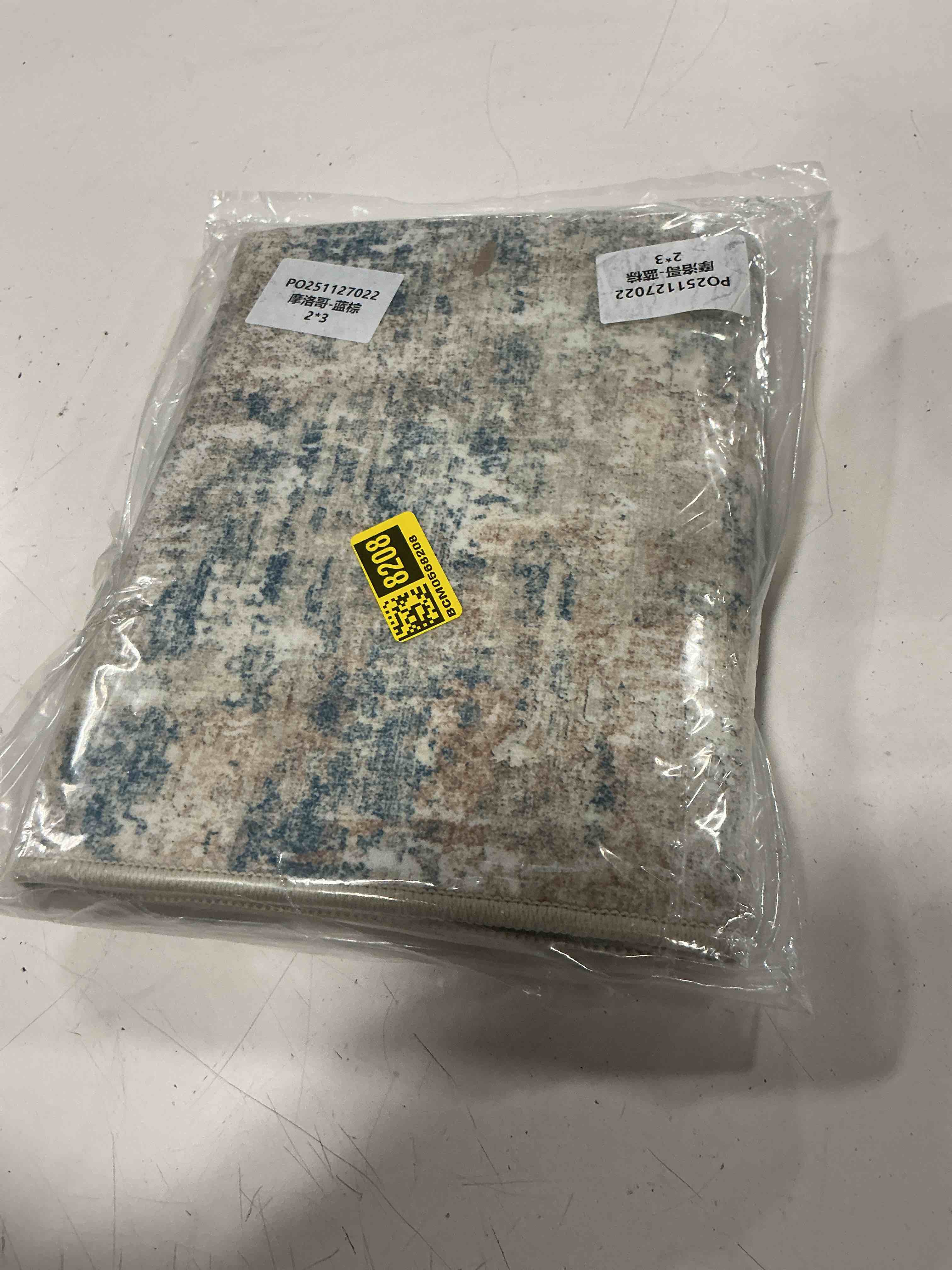Condition photo showing As Is for blue tan ivory rug (size unknown)
