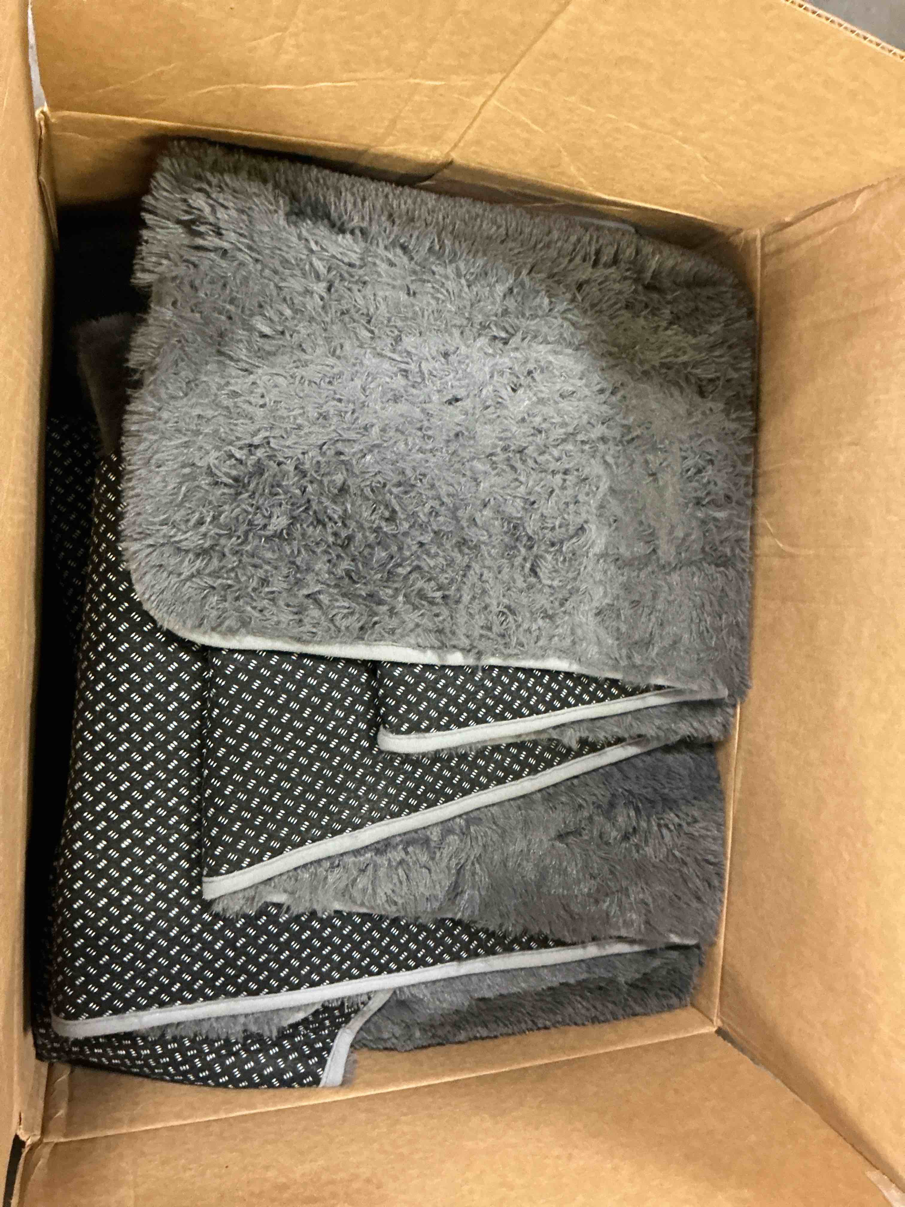 Condition photo showing As Is for dark grey low shag area rug, extra large 