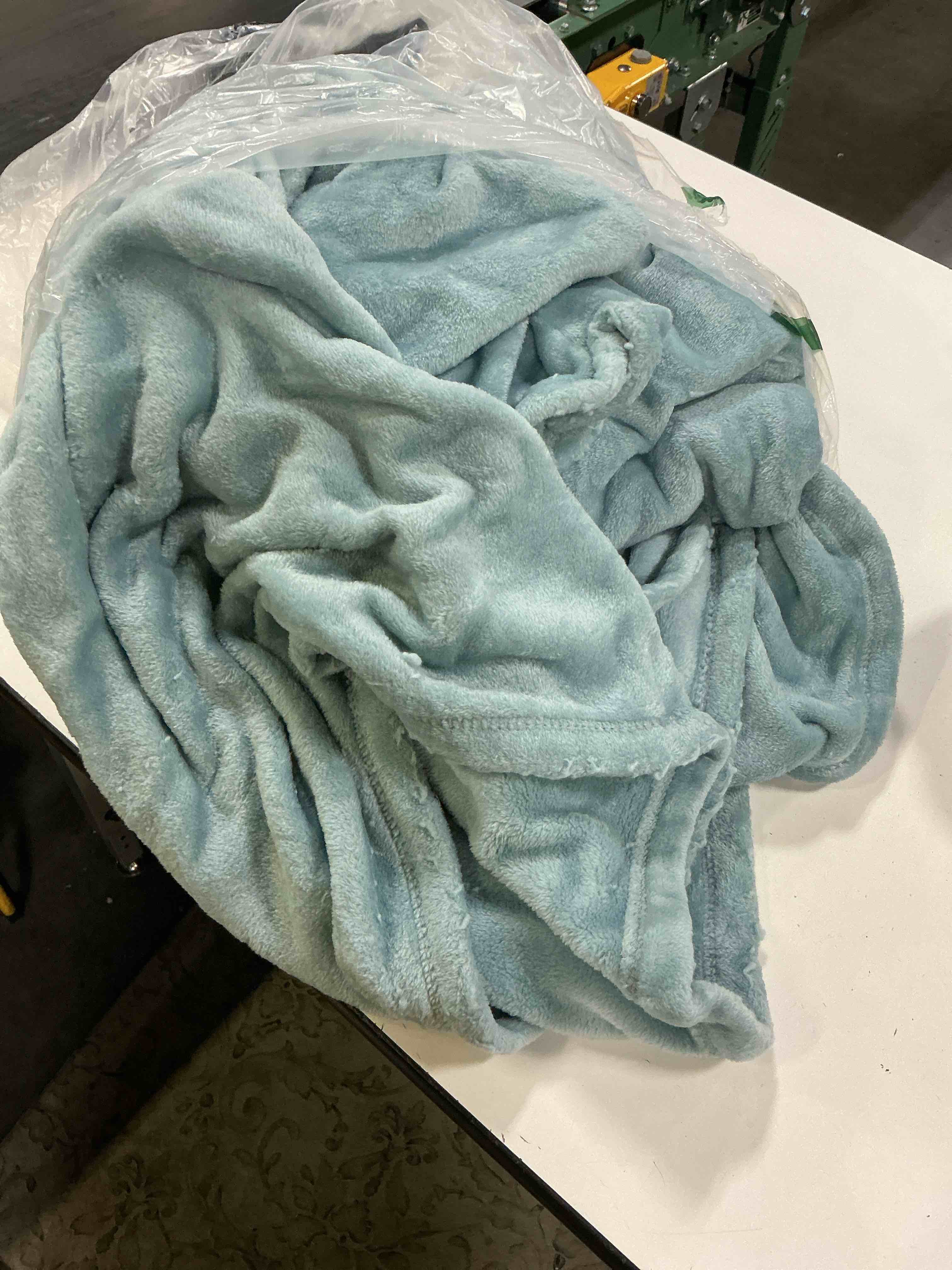 Condition photo showing As Is for baby blue fleece throw blanket