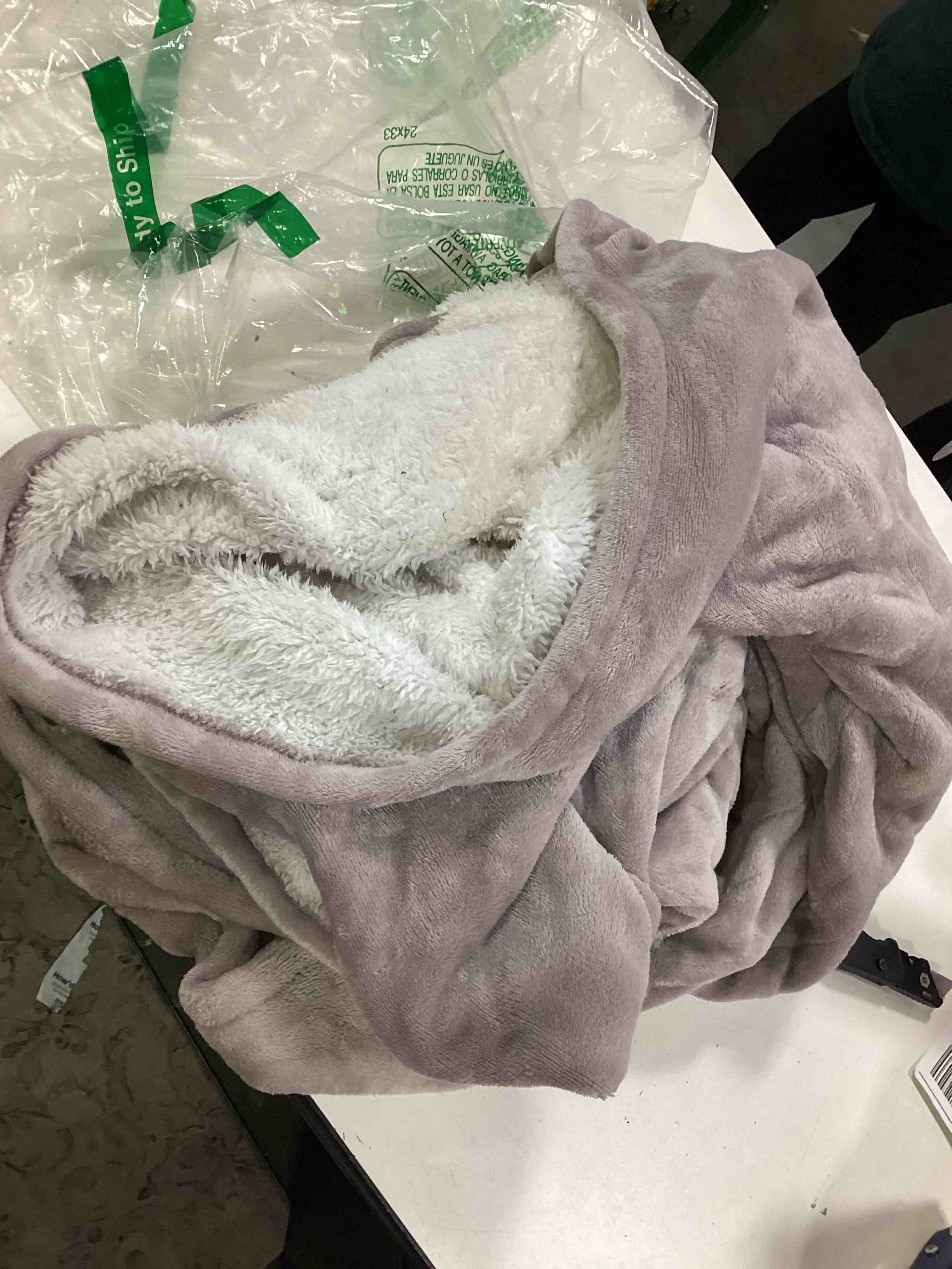 Condition photo showing As Is for purple sherpa heating blanket 