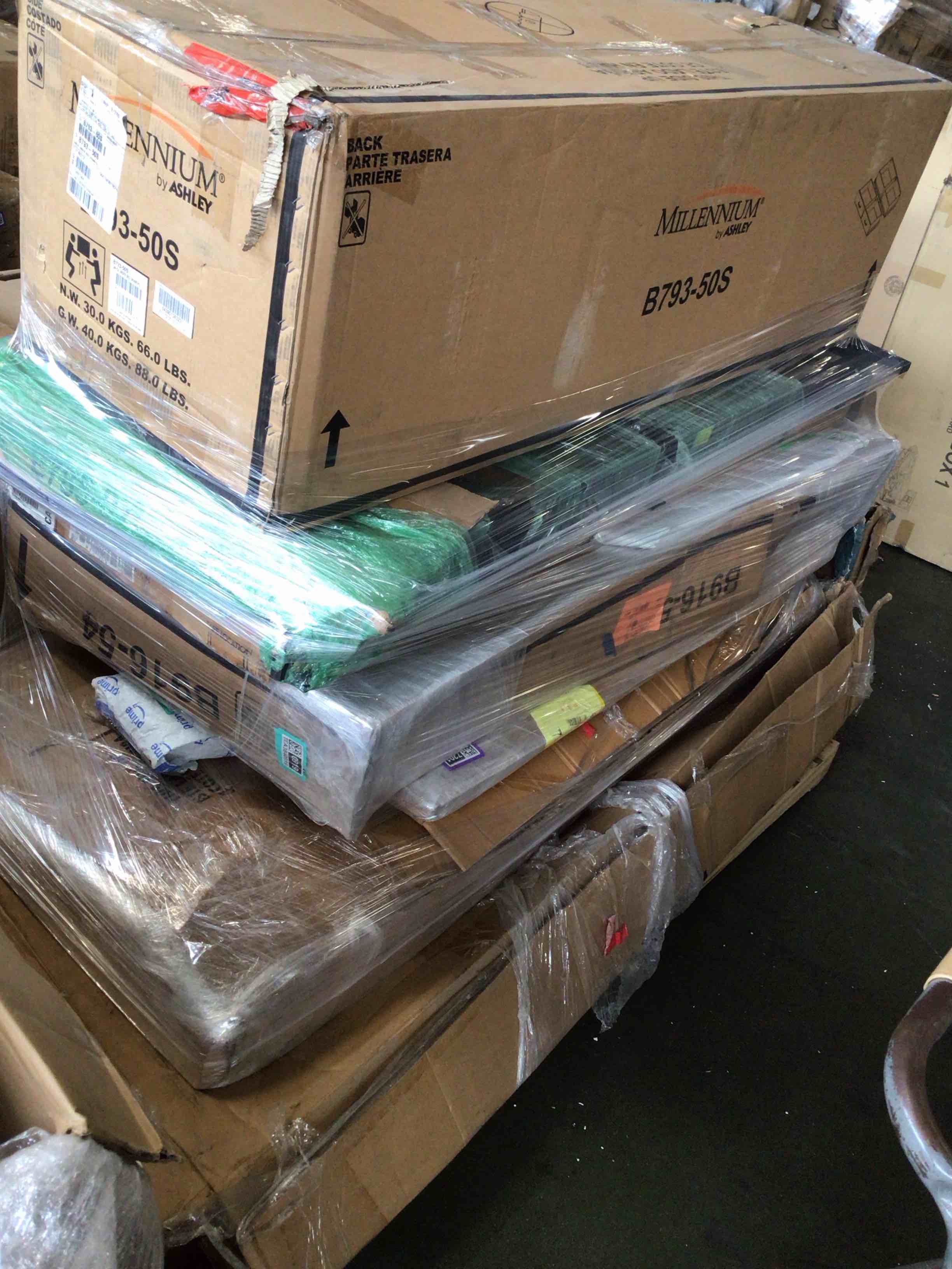 Condition photo showing As Is for pallet lot of back cushion, rails, footboard, and more
