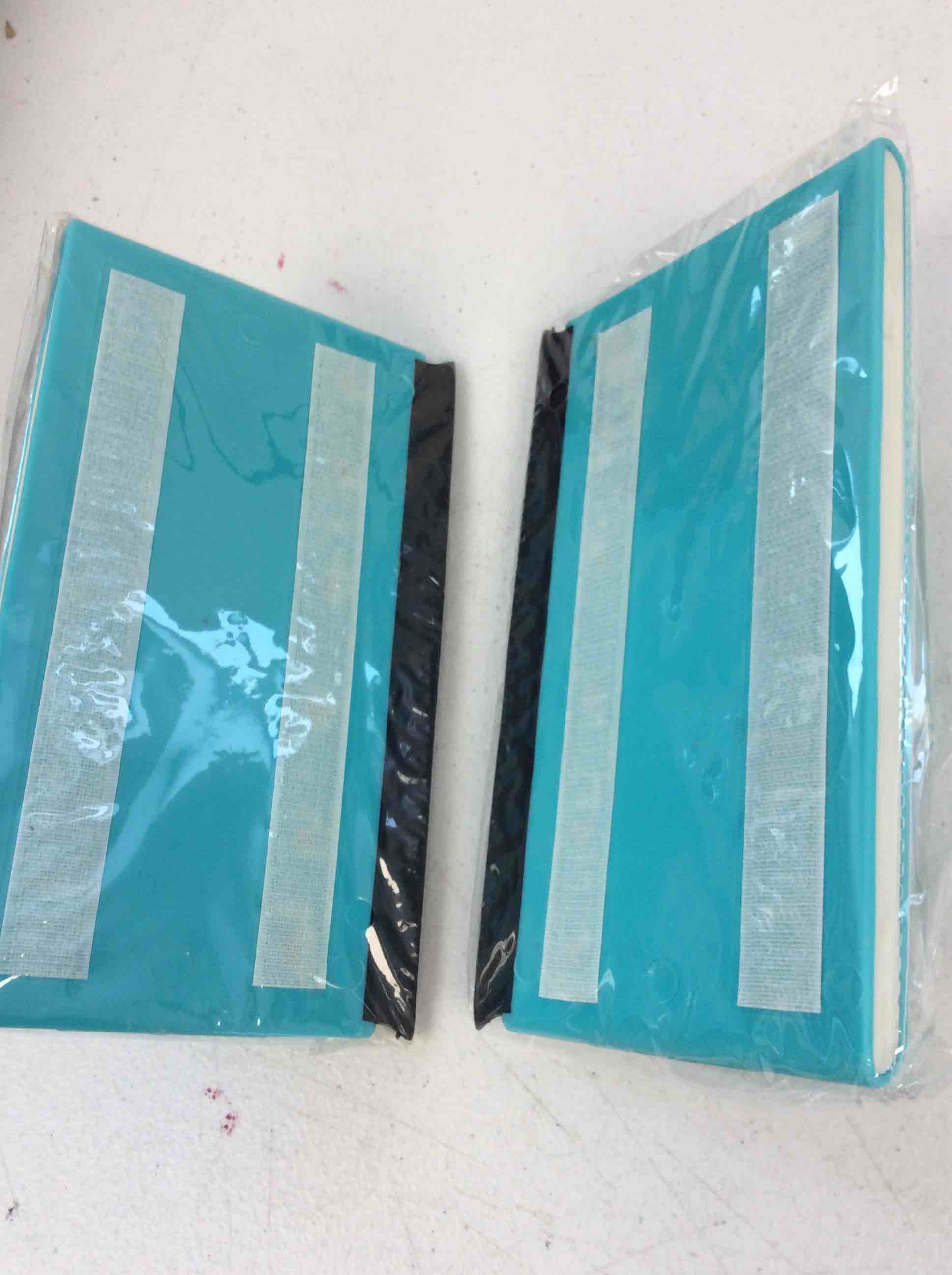 Condition photo showing New/Like New for two teal squeegees