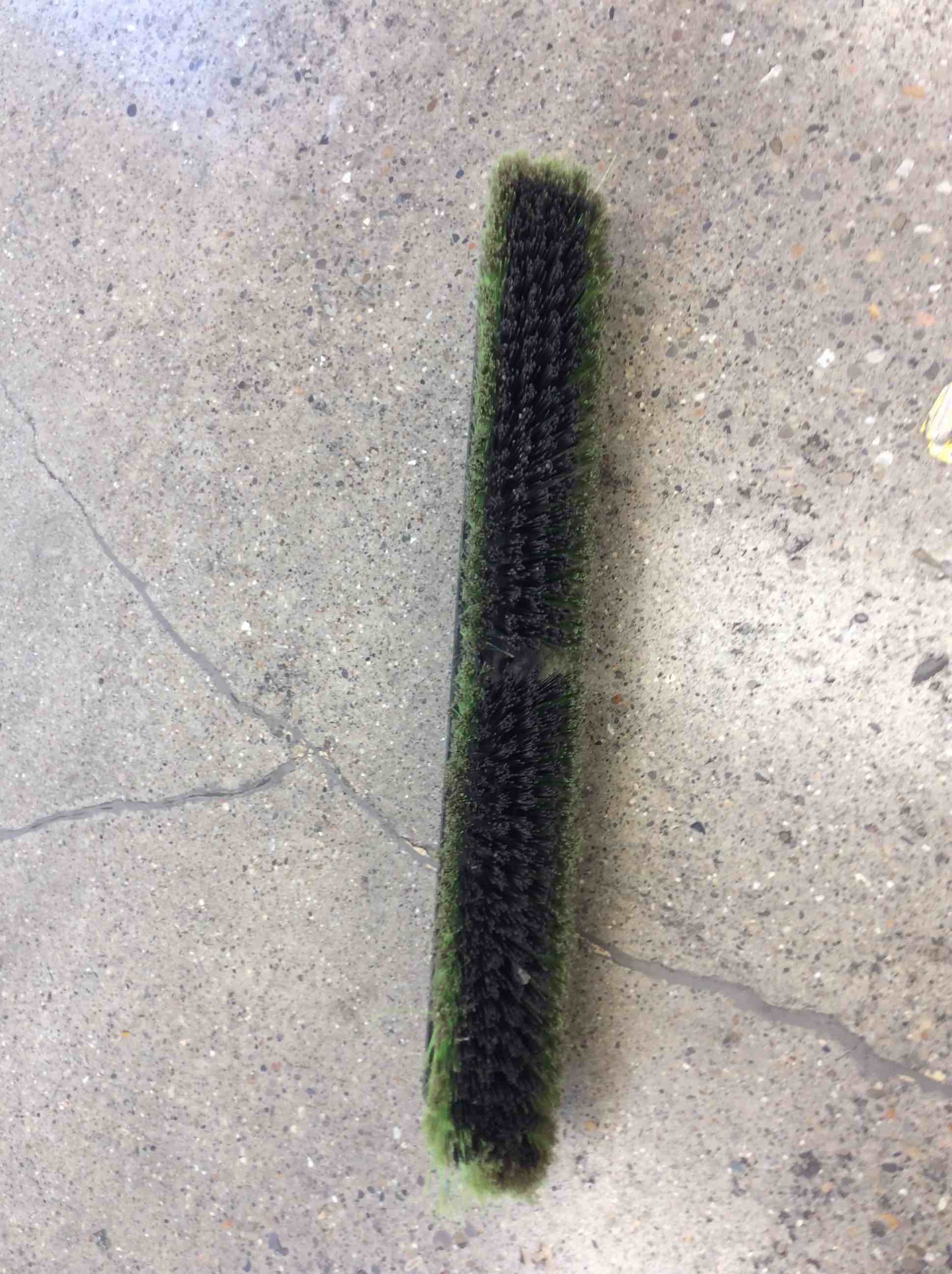 Condition photo showing As Is for dirty 24 inch green push broom