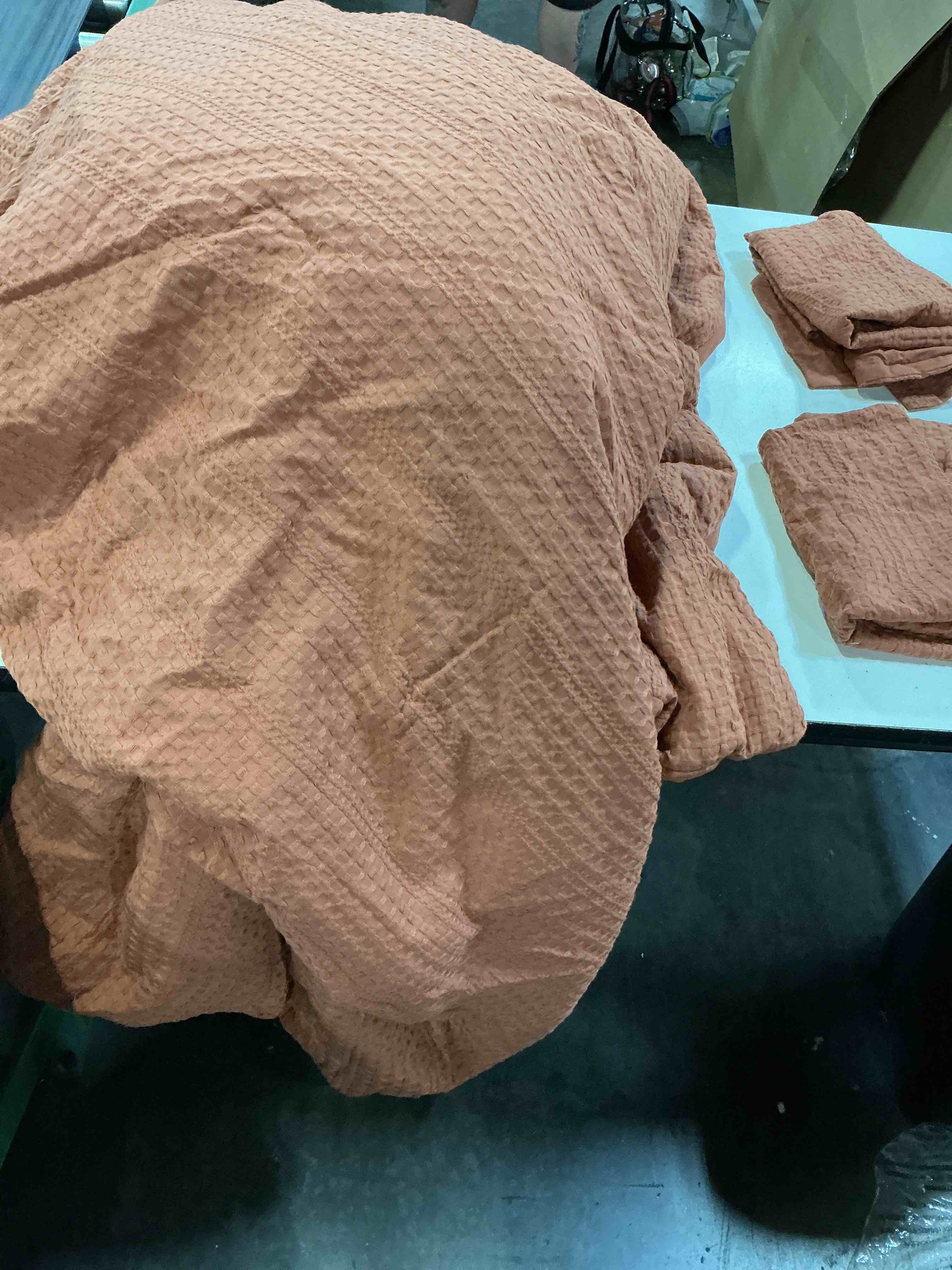 Condition photo showing As Is for phf waffle comforter set cal king, terracotta | soft waffle weave, lightweight & breathable all-season comfort. no pilling or fading. includes 1 comforter with 2 shams. 104 in x 90 in