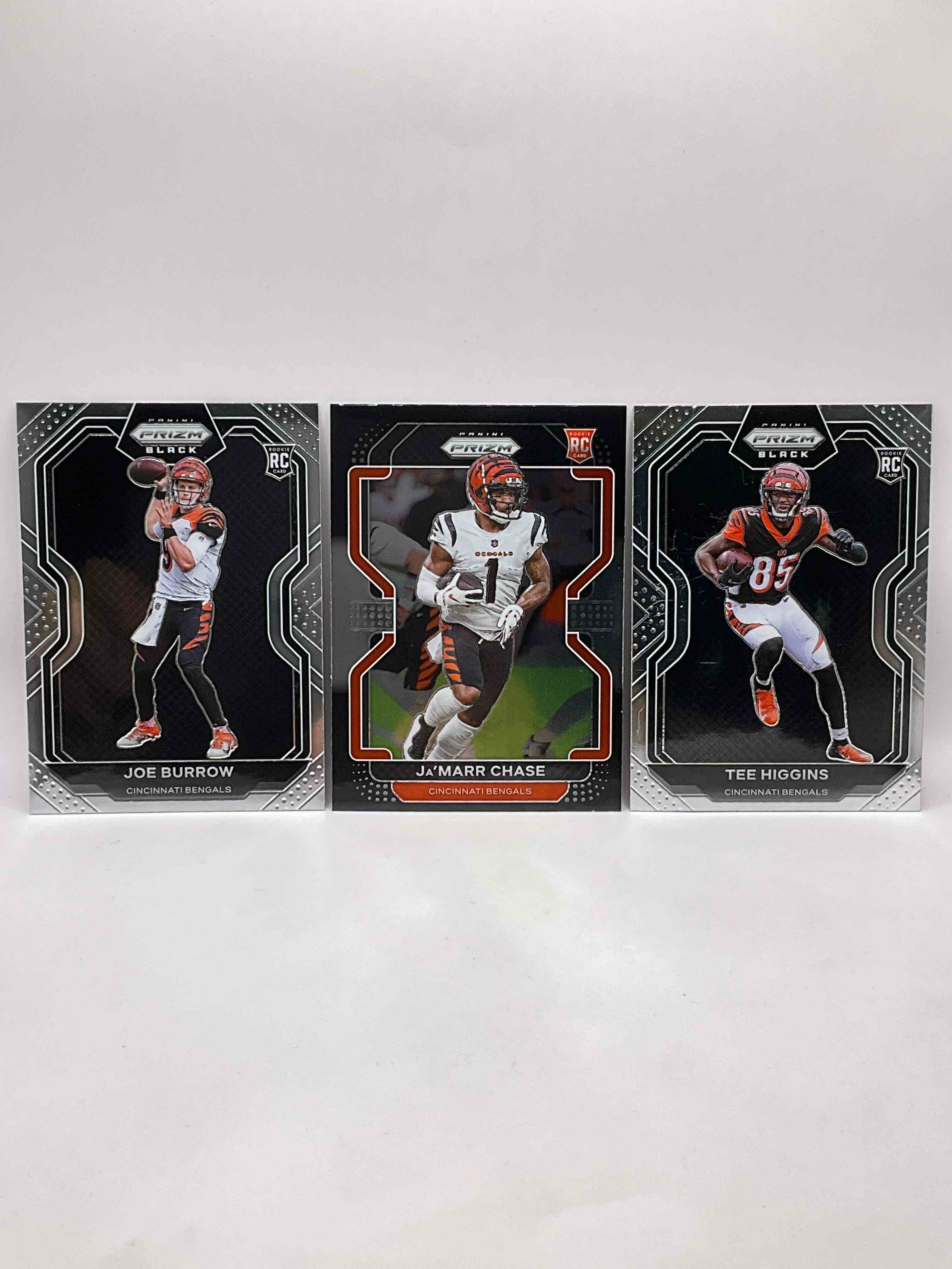  Bengals Fan Dream! 3 Elite Matching Rookie Cards, All Rare Prizm BLACK! Joe Burrow 2020 Prizm Black, Tee Higgins 2020 Prizm Black & Ja' Marr Chase 2021 Prizm Black. Hard To Collect! All Rookies, All Rare Prizm Black & All Mint! 