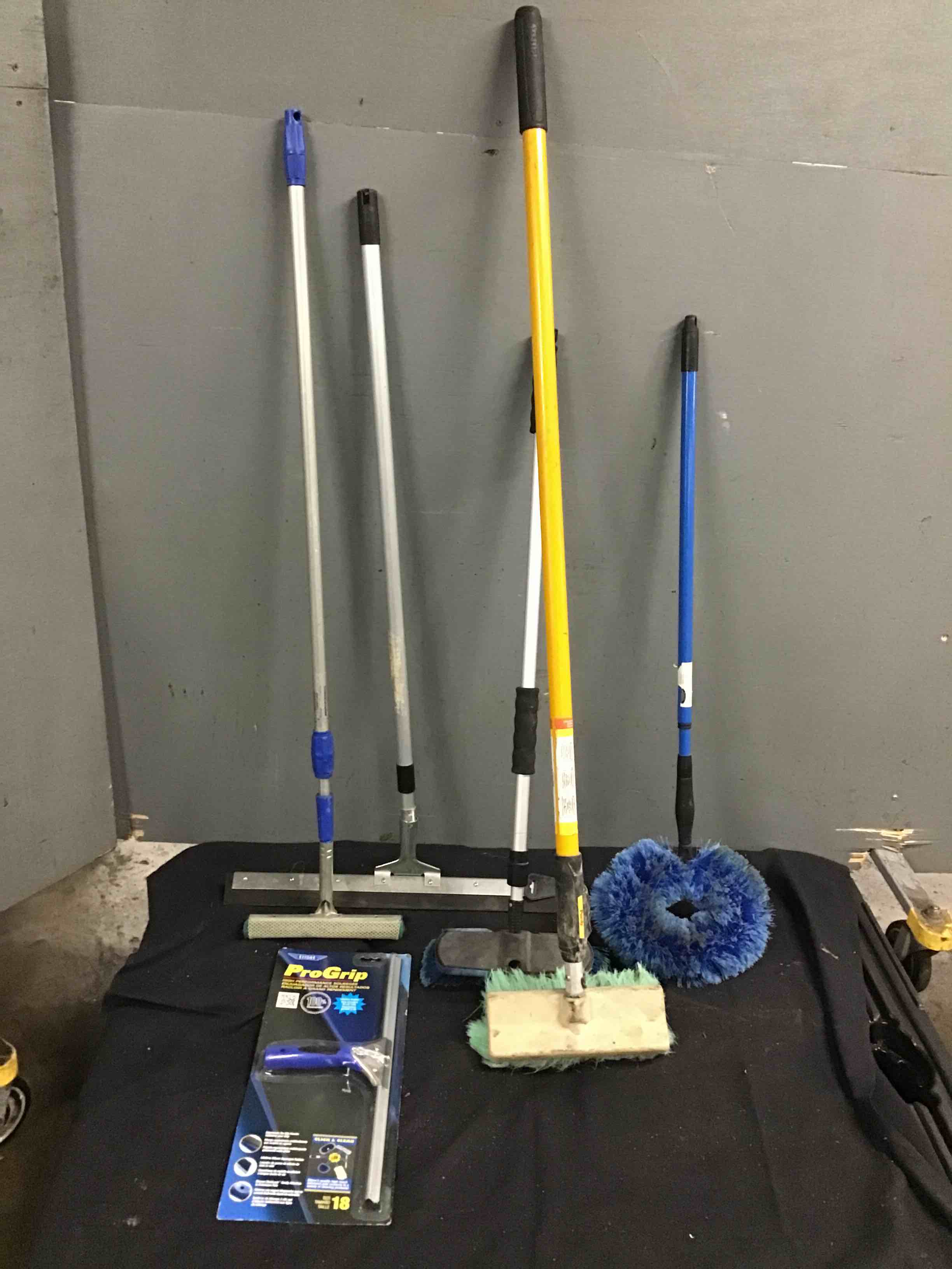 Assorted Squeegees And Floor Scrub Brushes 