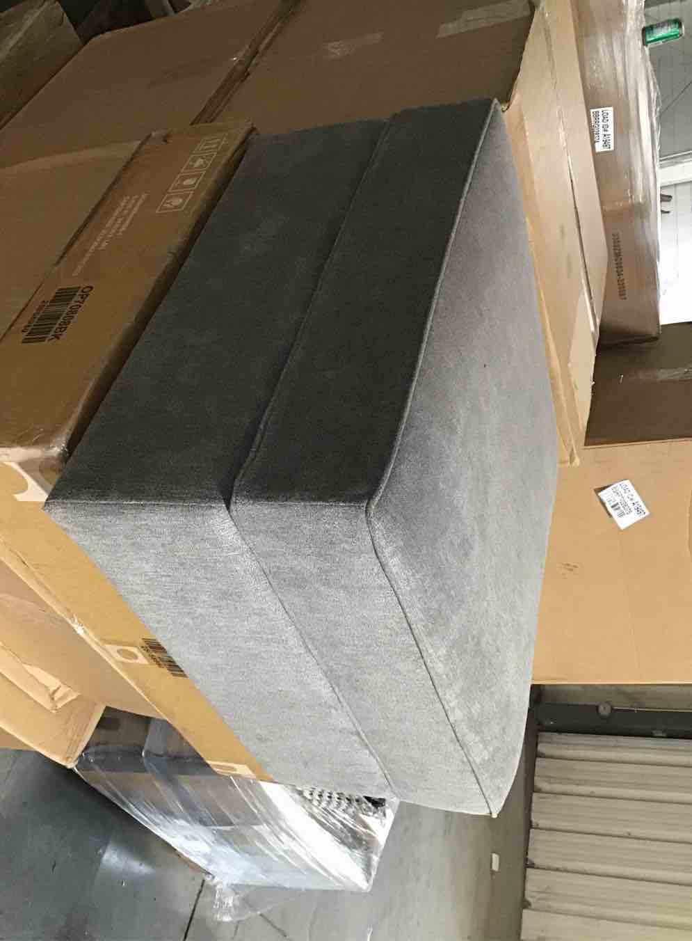 Large square grey upholstered storage ottoman, sofa arm for chair, and a matching pillow 
