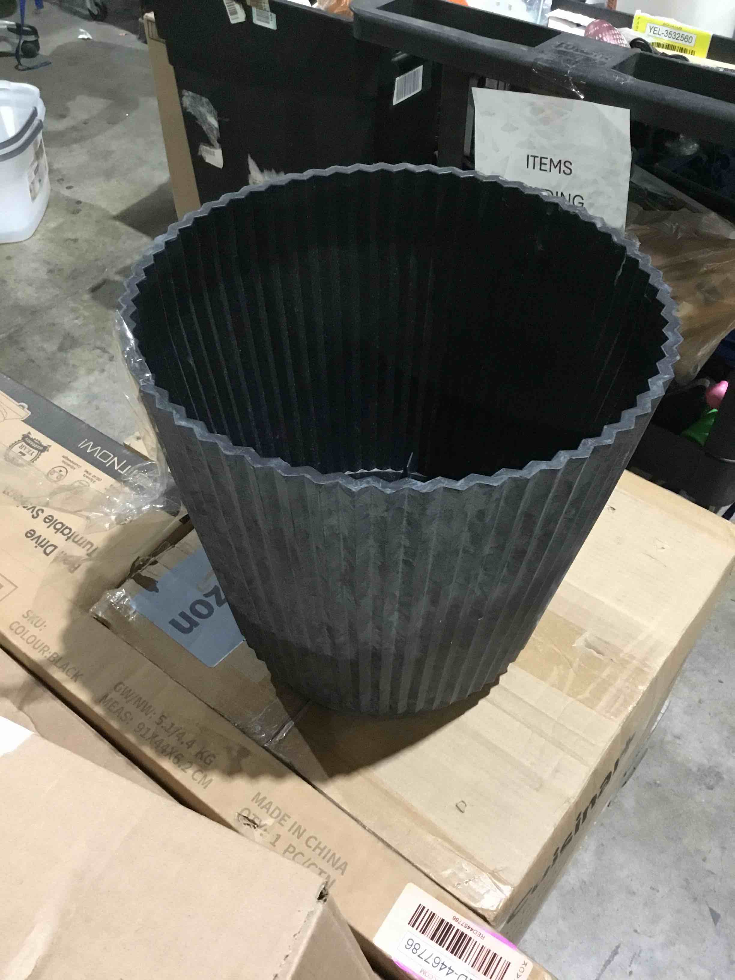 Condition photo showing As Is for style selections round black planter 