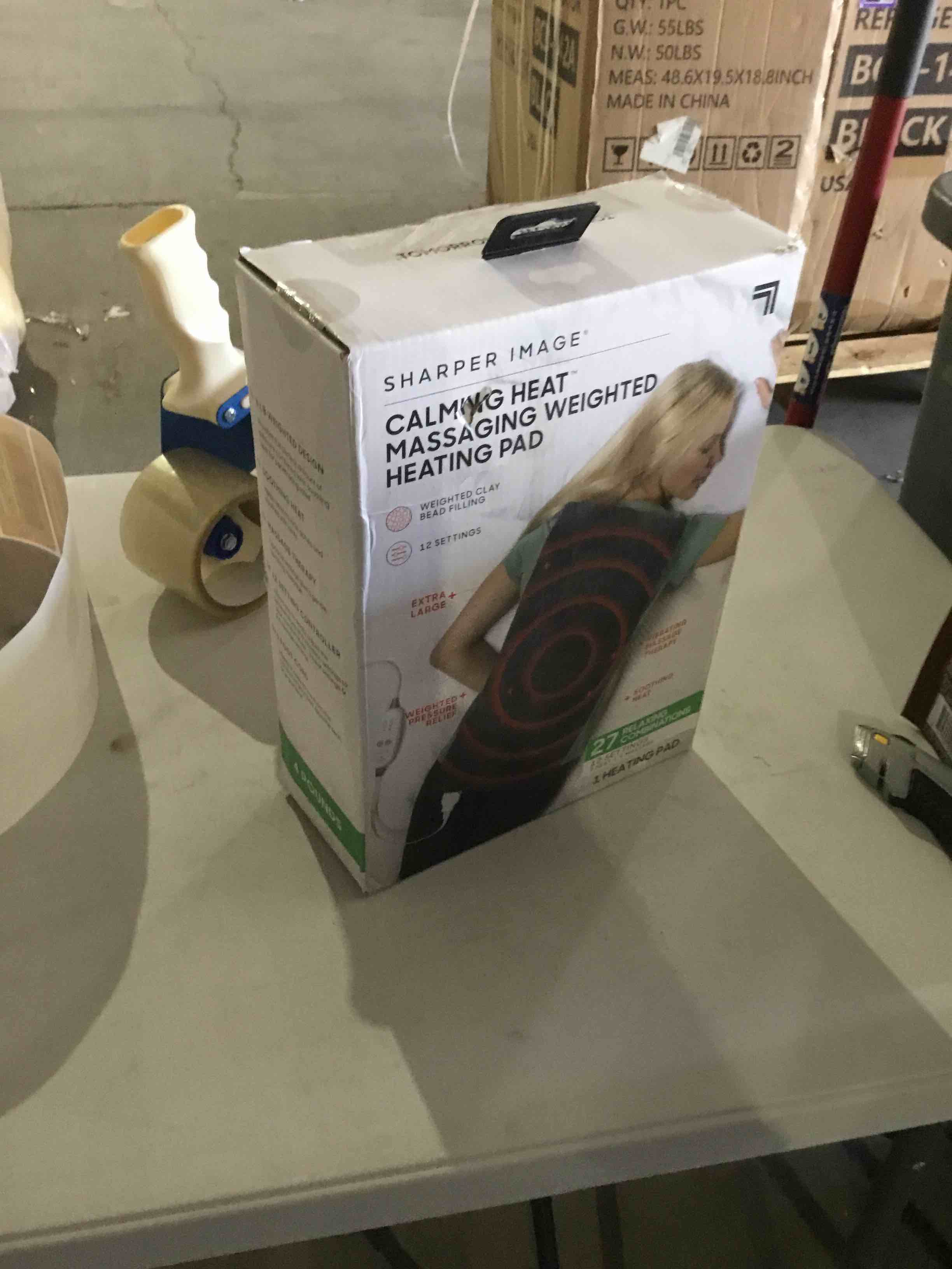 Condition photo showing As Is for calming heat massaging weighted heating pad by sharper image- electric heating pad with massaging vibrations, auto-off,12 settings- 3 heat, 9 massage- 27 relaxing combinations, 12” x 24”, 4lbs