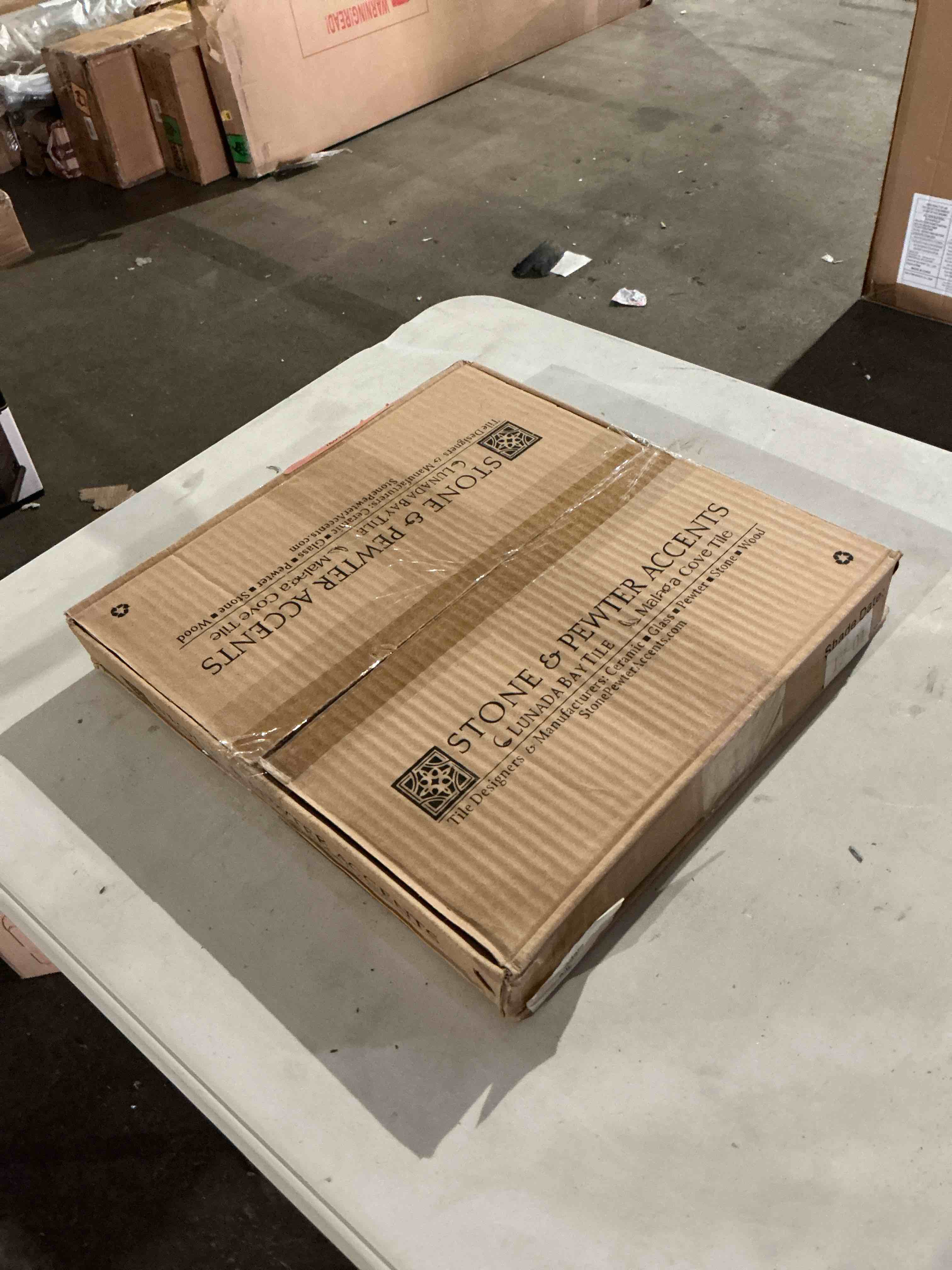Condition photo showing New/Like New for 12 in. x 12 in. agate martini color: bassano, with silk finish, 5 sheets per box, 5 sq. ft. per box bid per sq. ft. 