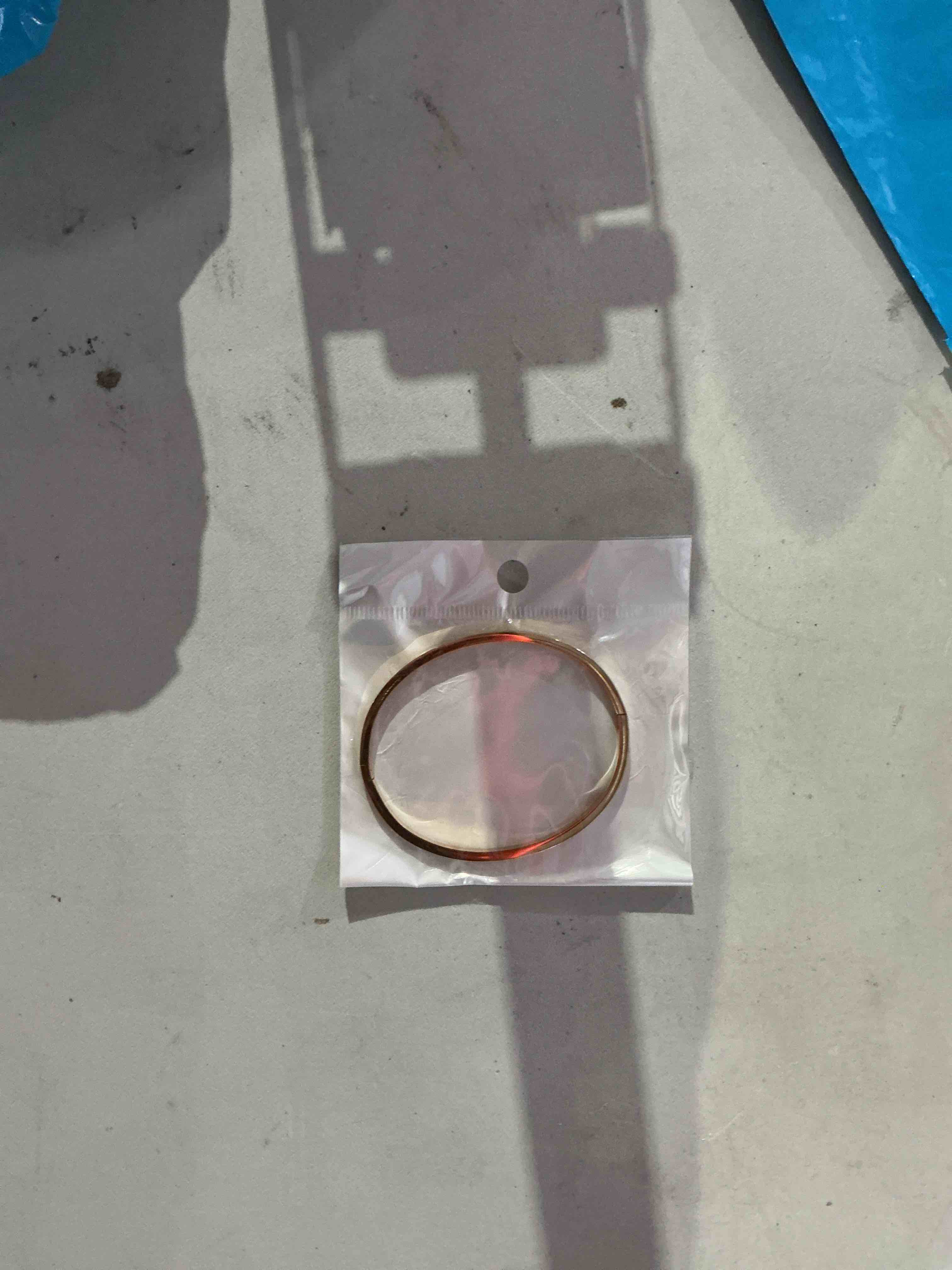 Condition photo showing New/Like New for elegant and timeless, polished gold-tone bangle bracelet