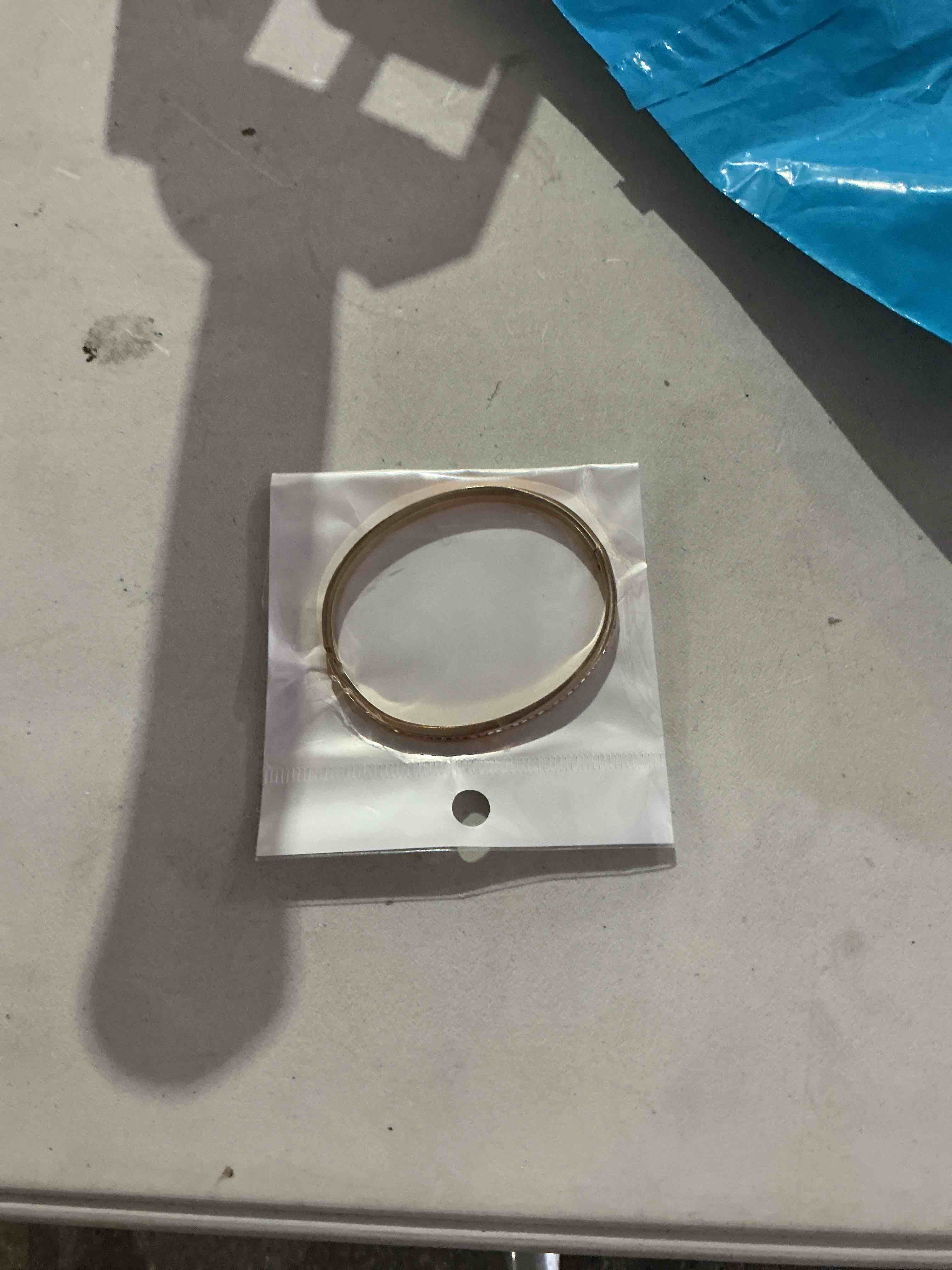 Condition photo showing New/Like New for elegant and timeless,  polished gold-tone bangle bracelet 