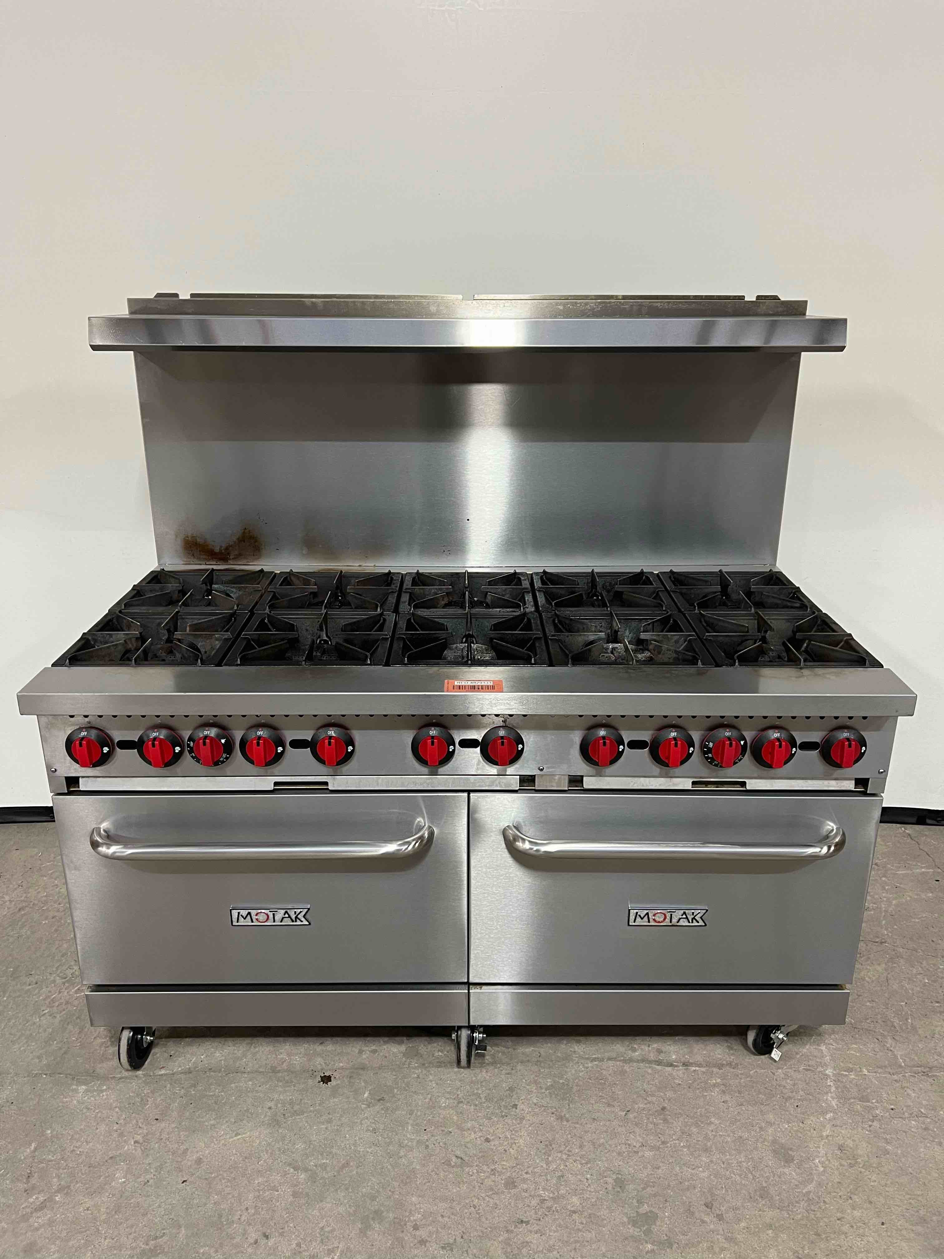 2021 MOTAK 60 INCH NATURAL GAS 10 BURNER RANGE WITH DOUBLE OVENS ON CASTERS