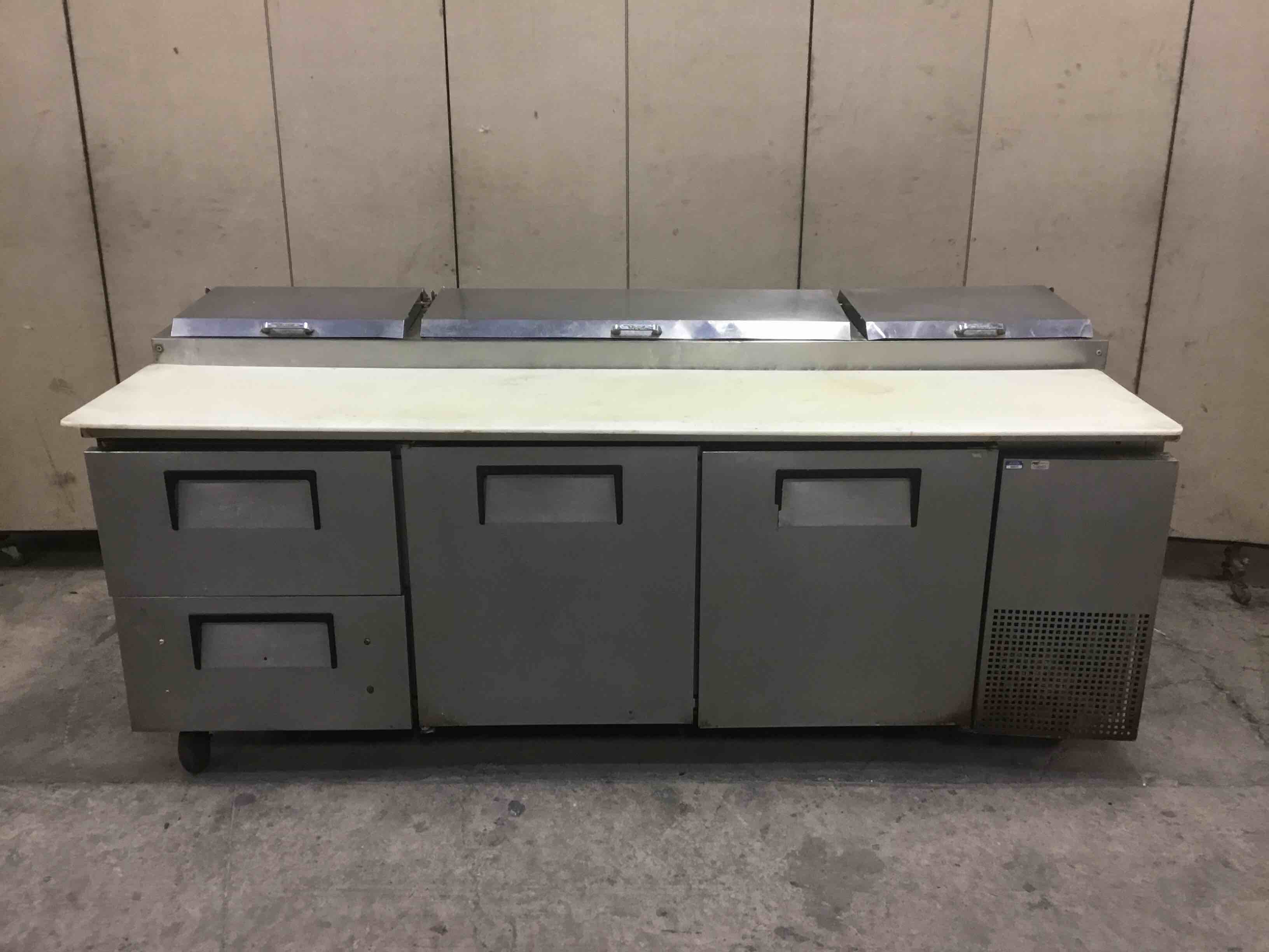TRUE 93 INCH STAINLESS STEEL 2 DOOR 2 DRAWER REFRIGERATED PIZZA PREP TABLE ON CASTERS 