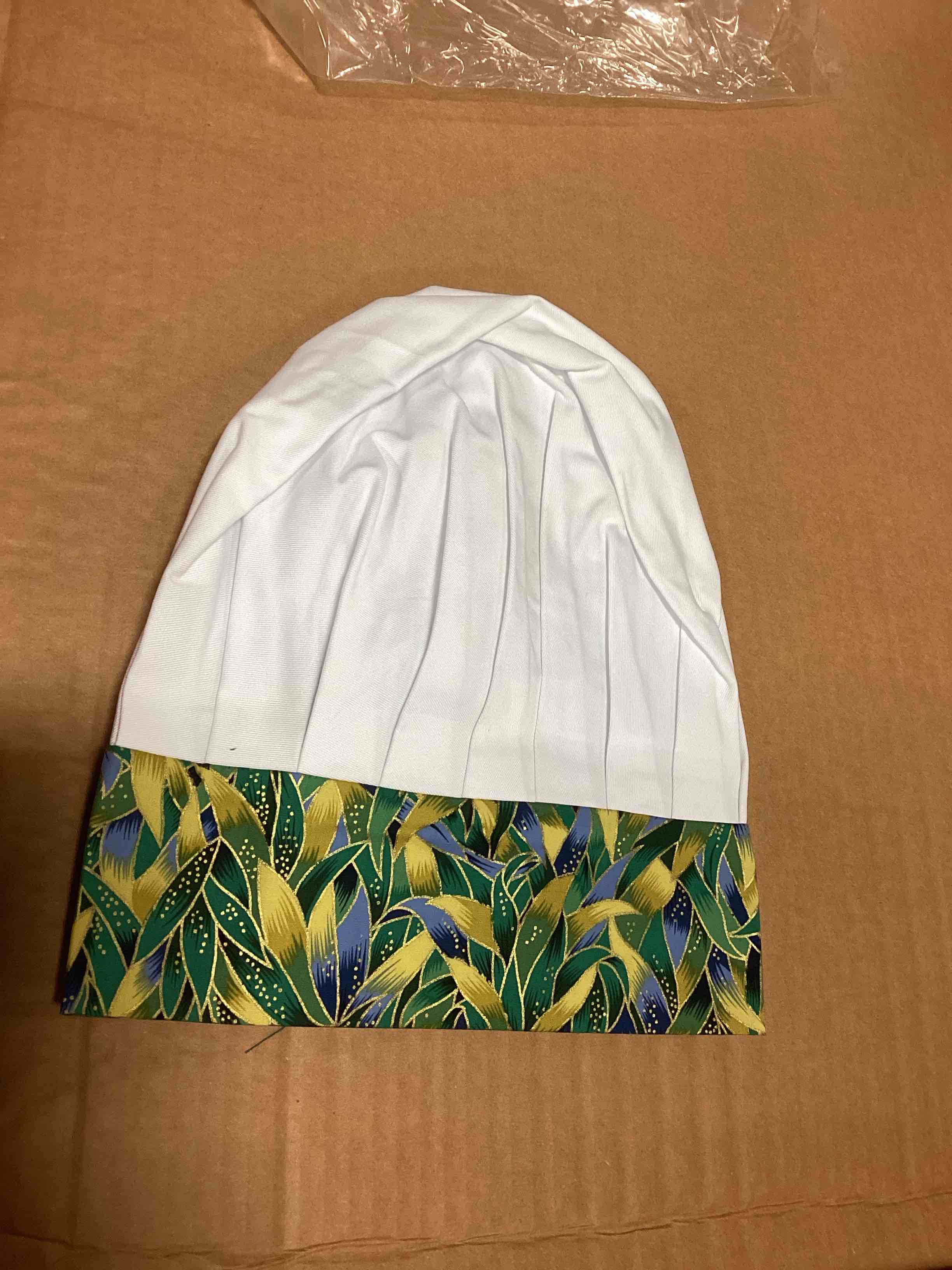 white chef hats with green leafy design
