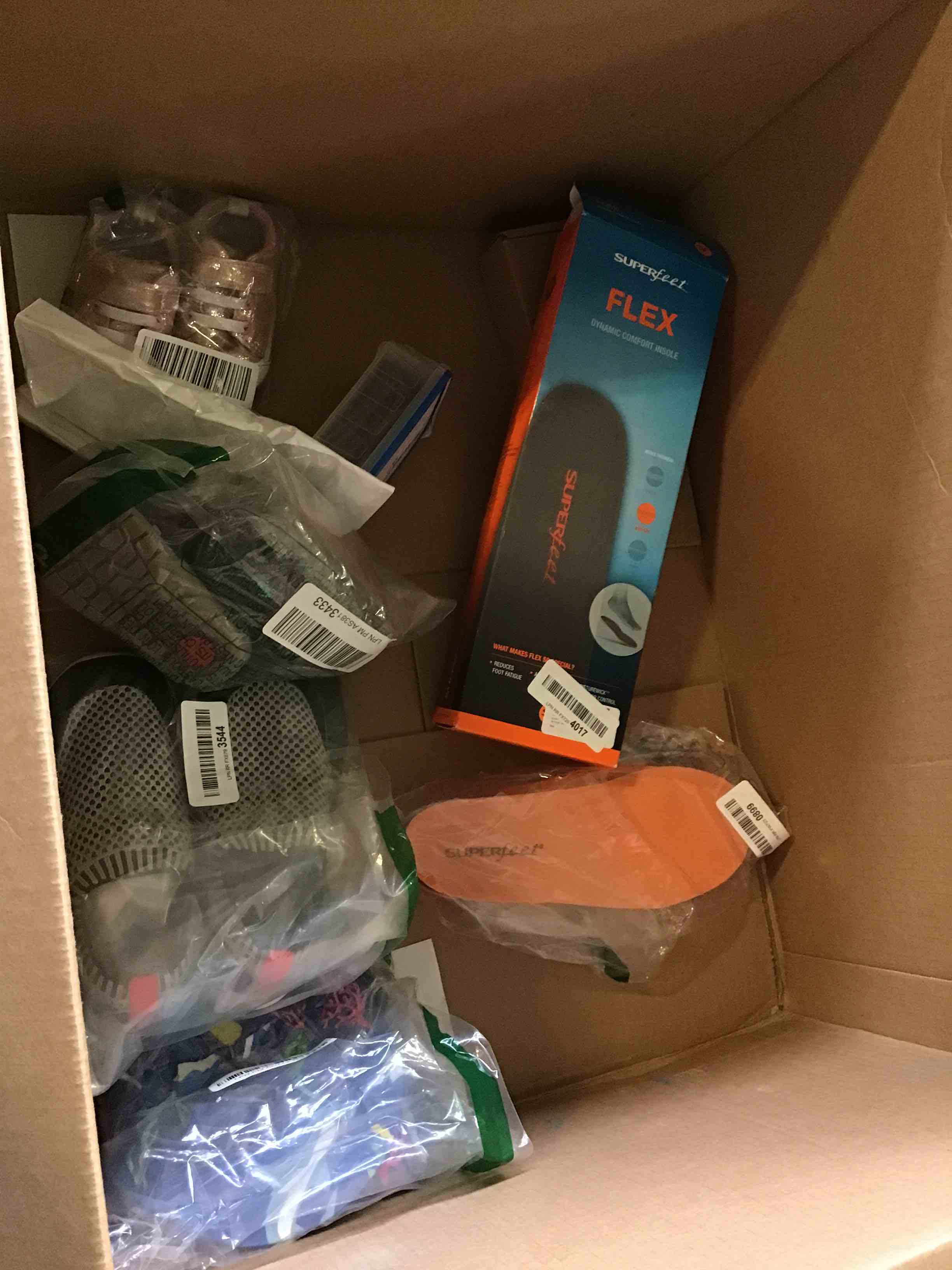Assortment of Miscellaneous products (May Include product lux pro, superfeet , shoes girls , and more 