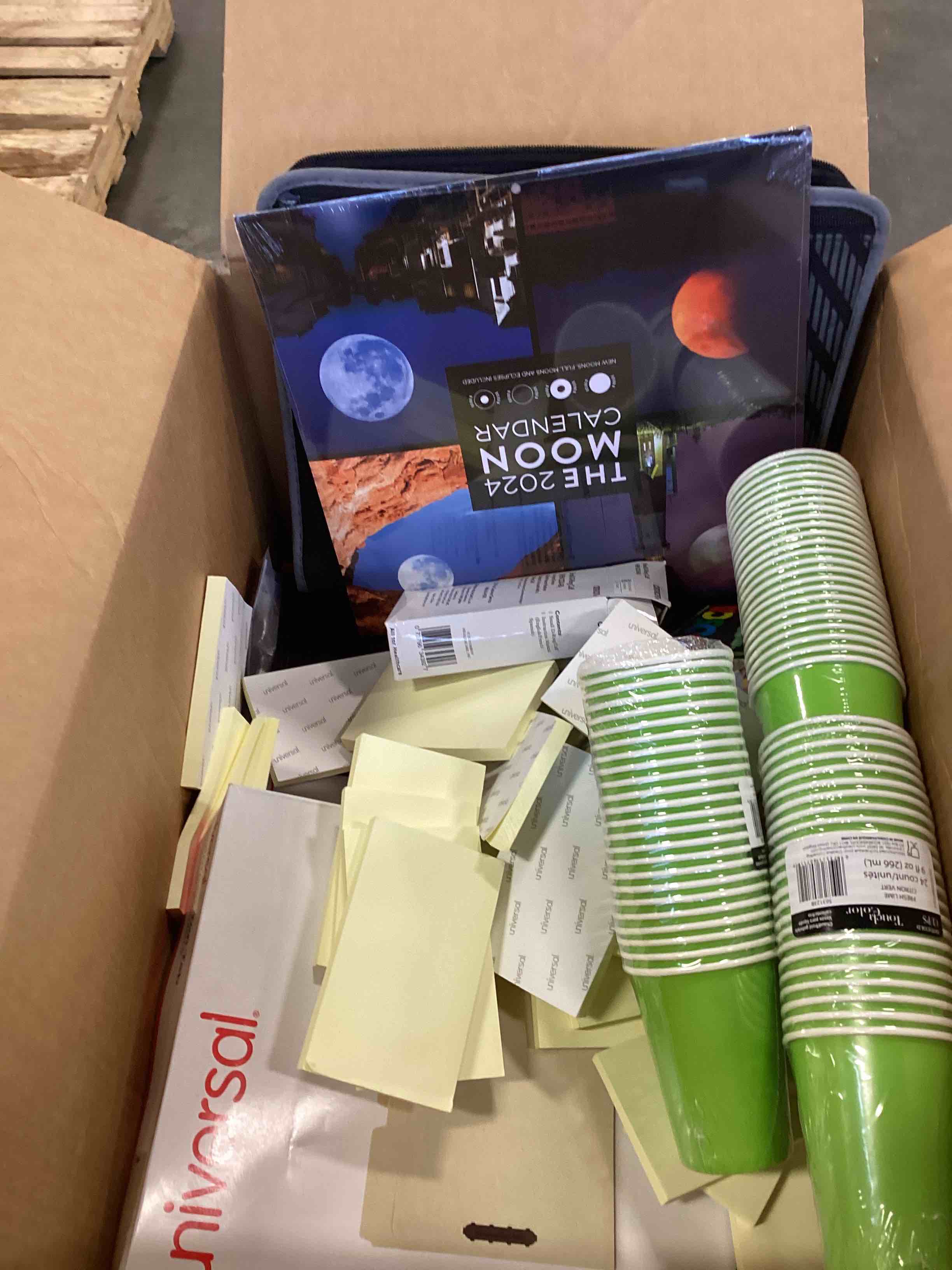 Assorted office products include  cups, folders, paper , colors and more 