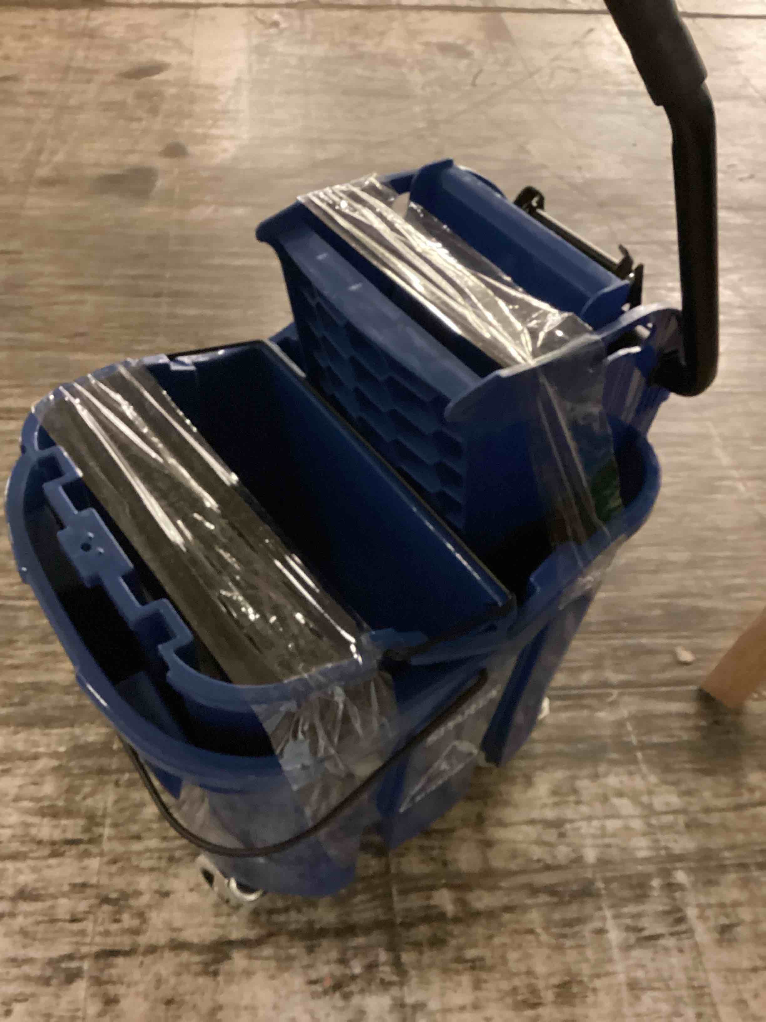 Condition photo showing As Is for carlisle foodservice products omnifit mop bucket with side press wringer and soiled water insert for floor cleaning, kitchens, restaurants, and janitorial use, polypropylene (pp), 35 quarts, blue