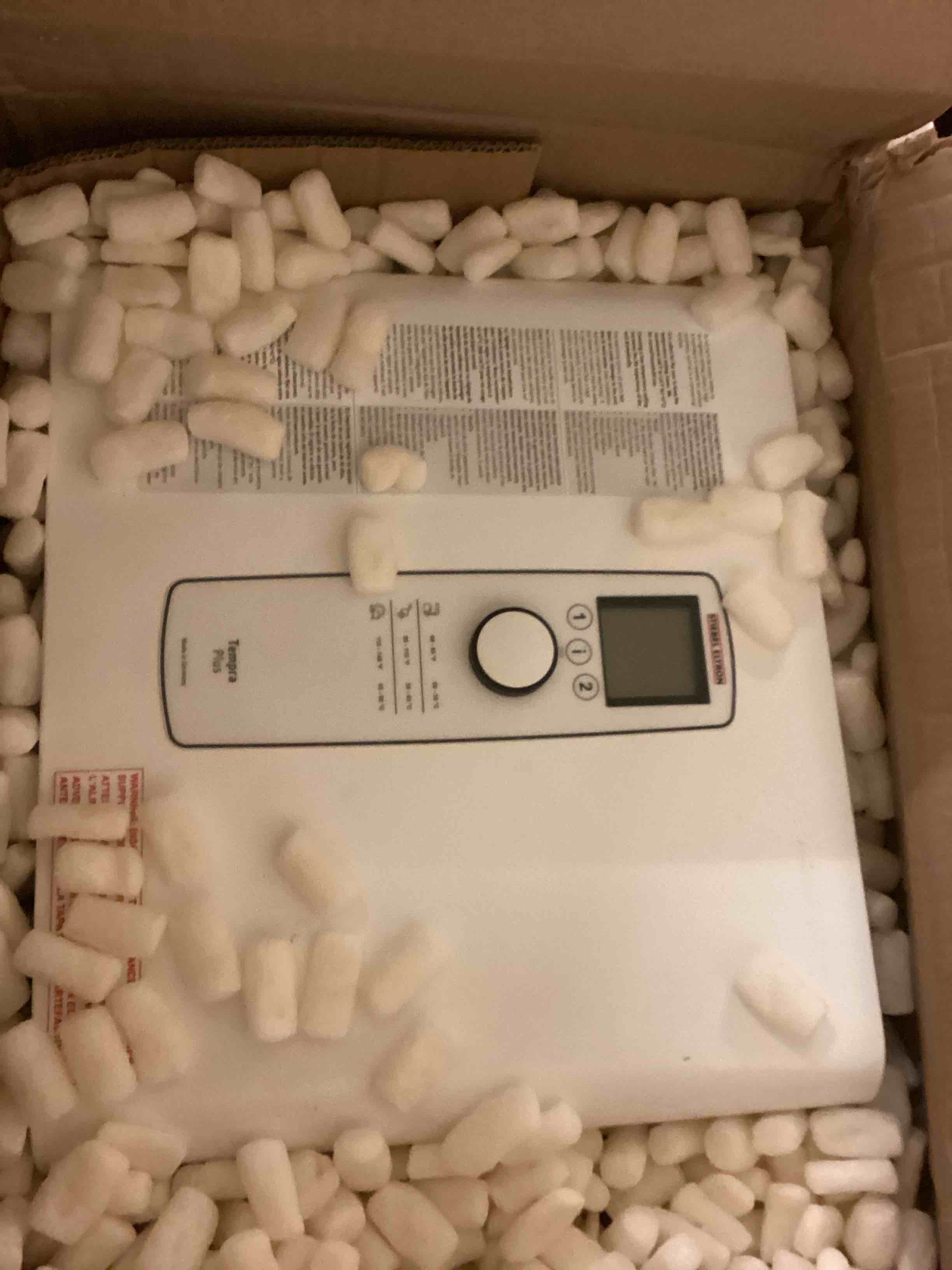 Condition photo showing As Is for stiebel eltron tankless water heater – tempra 29 plus – electric, on demand hot water, eco, white 29 (kw) tempra plus