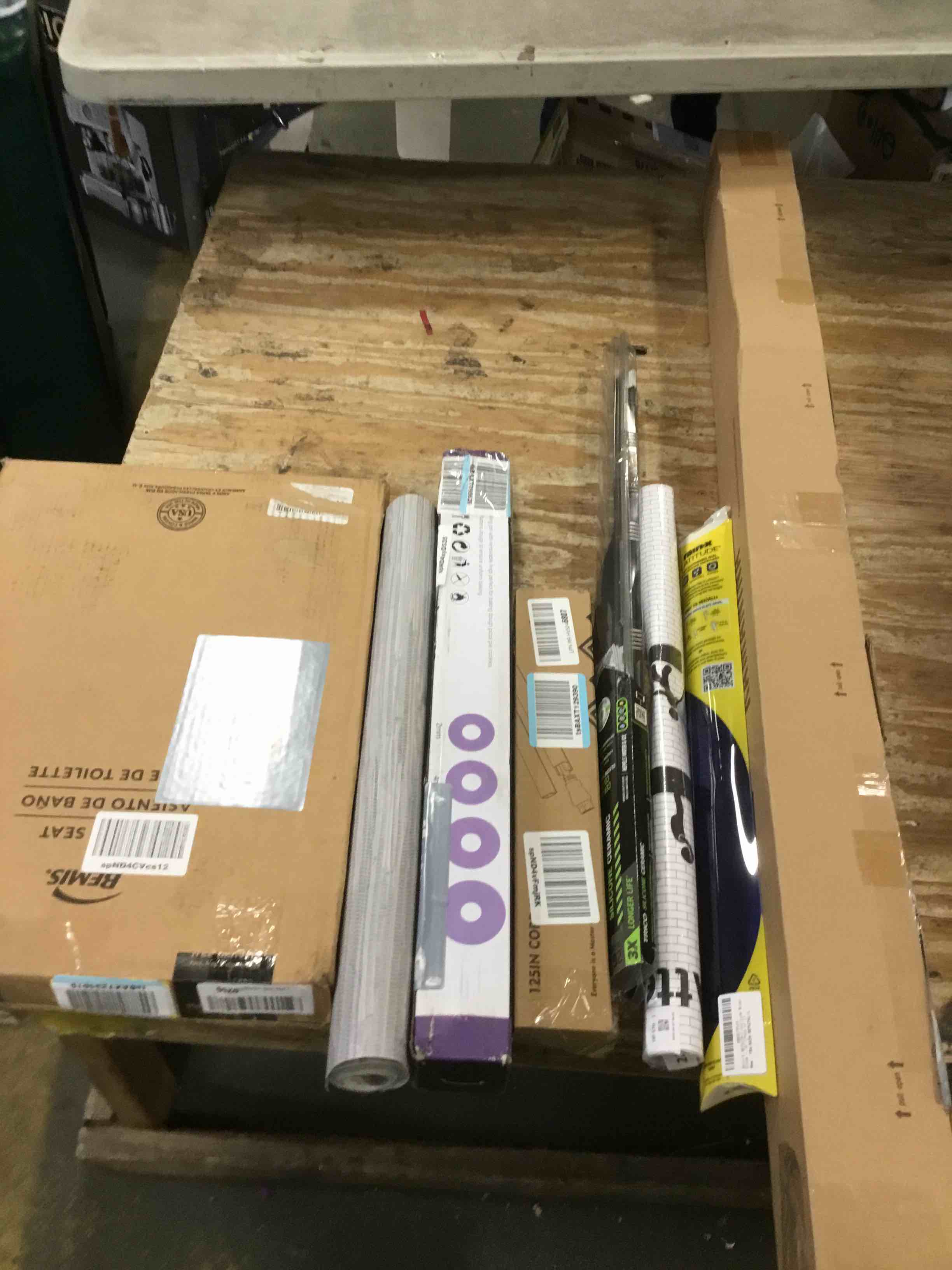 assorted miscellaneous items (toilet seat, wall paper, curtain rod and more)